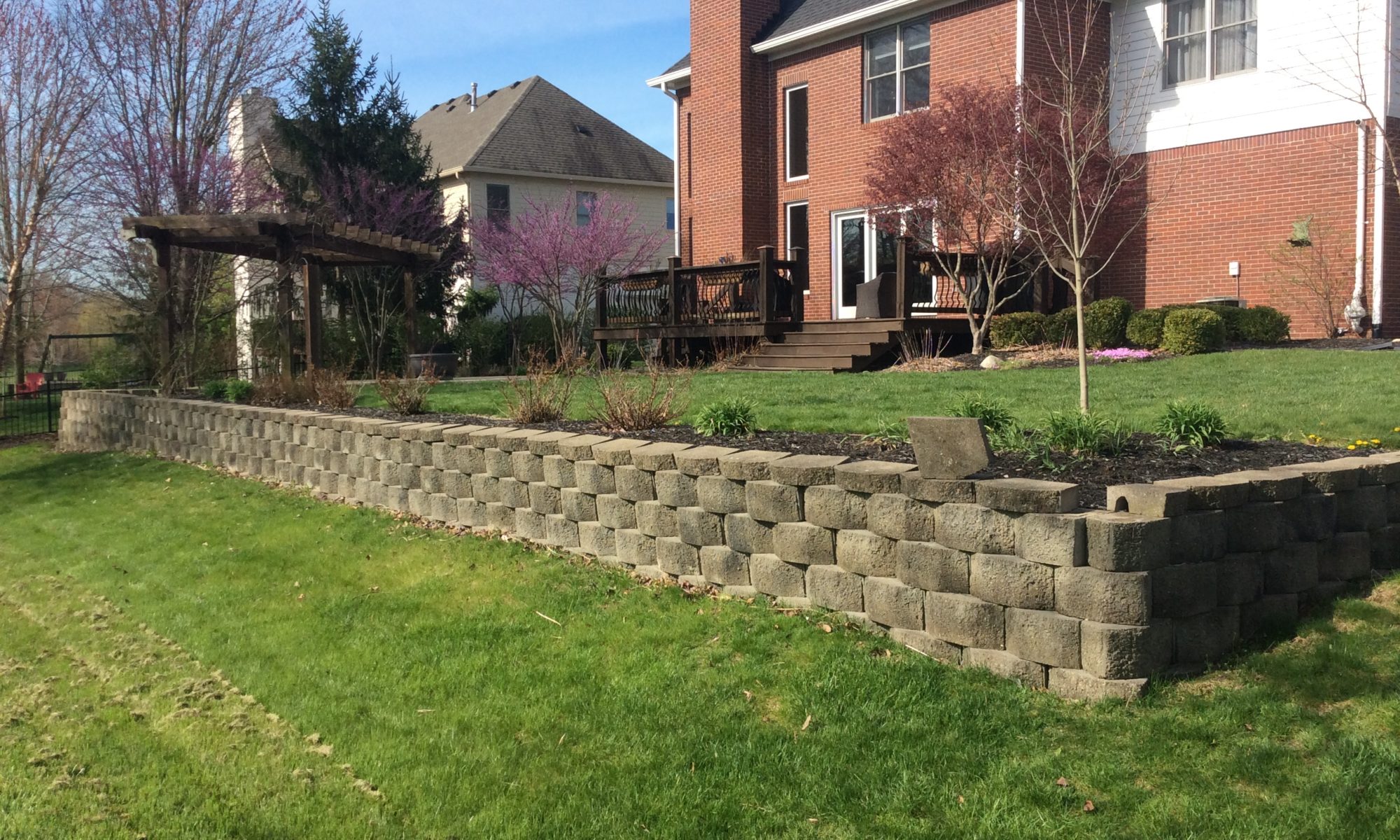 Precision Outdoors Zionsville Retaining Wall rejuvenate existing landscaping indiana refresh backyard side yard