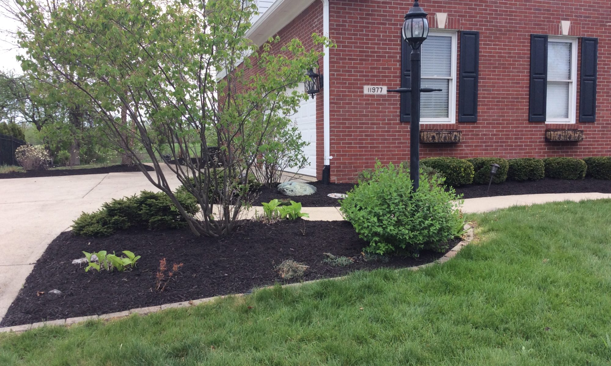 Precision Outdoors Zionsville Retaining Wall rejuvenate existing landscaping indiana refresh backyard side yard