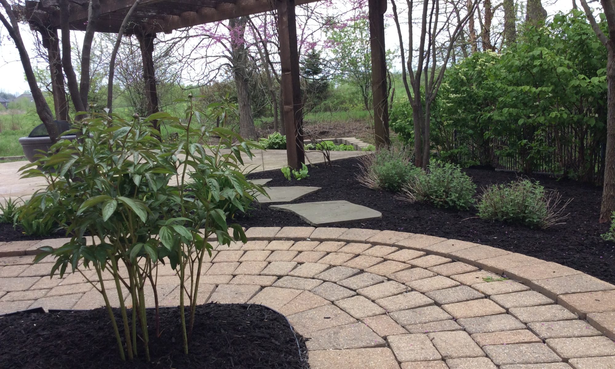 Precision Outdoors Zionsville Retaining Wall rejuvenate existing landscaping indiana refresh backyard side yard