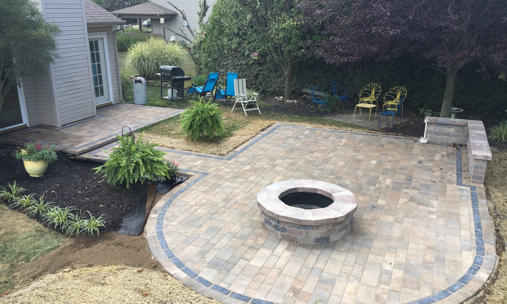 Precision Outdoors Rounded Paver Patio custom round fire pit reimagined living space Noblesville indiana