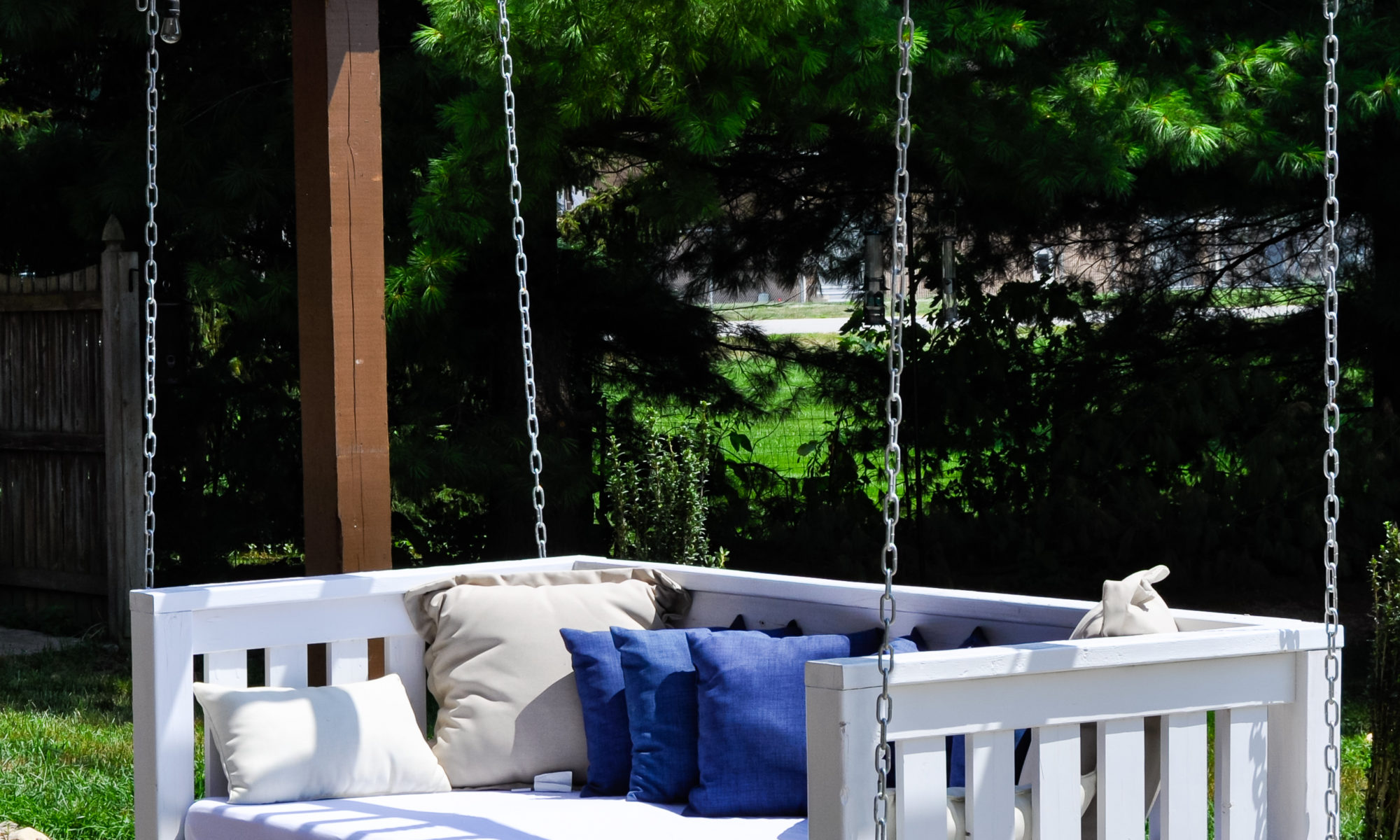 Precision Outdoors Pergola & Patio Cedar Pergola wrap around gathering entertaining custom built furniture bench swing three piece deck chair set playground pad play space simple concrete patio installation custom daybed swing Greenwood indiana