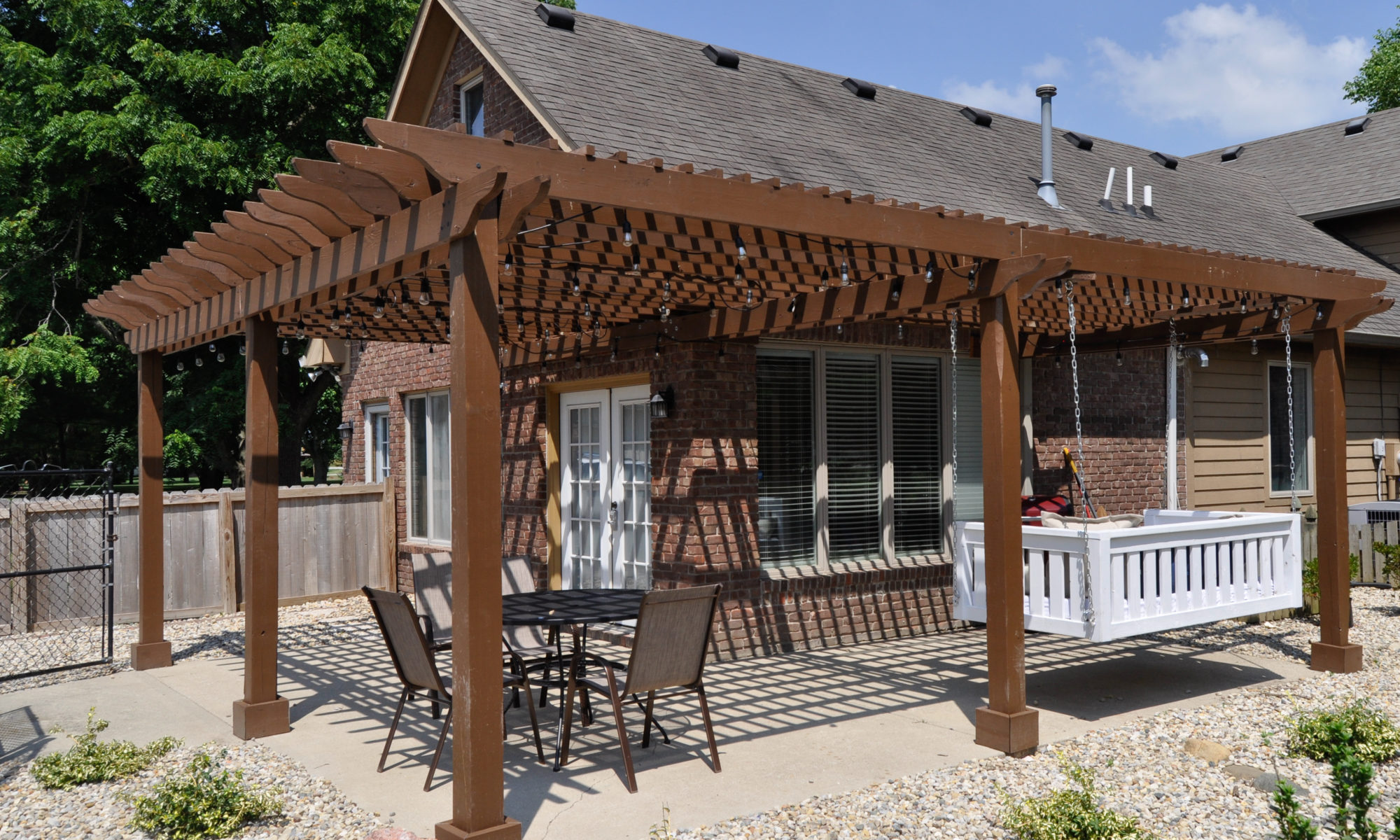 Precision Outdoors Pergola & Patio Cedar Pergola wrap around gathering entertaining custom built furniture bench swing three piece deck chair set playground pad play space simple concrete patio installation custom daybed swing Greenwood indiana