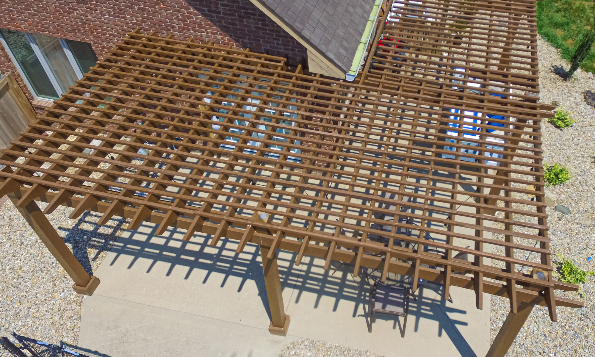 Precision Outdoors Pergola & Patio Cedar Pergola wrap around gathering entertaining custom built furniture bench swing three piece deck chair set playground pad play space simple concrete patio installation custom daybed swing Greenwood indiana