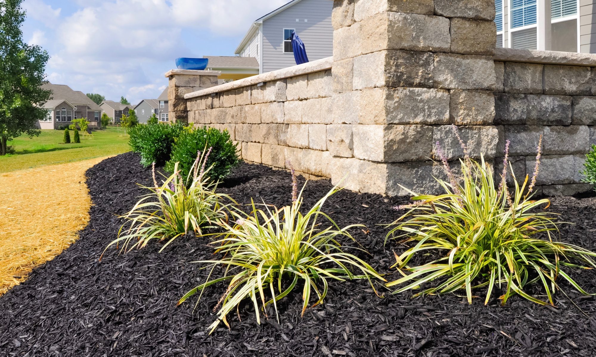 Precision Outdoors Noblesville Paver Patio paver patio raised gathering space backyard natural blended lights safe clear visibility night raised retaining wall limestone rock materials trim endcaps landscaping mulch installation straw seed placement unblock beacon hill smooth pavers opal hollandstone charcoal color accents estate wall materials alpine grey indiana entertaining space gathering