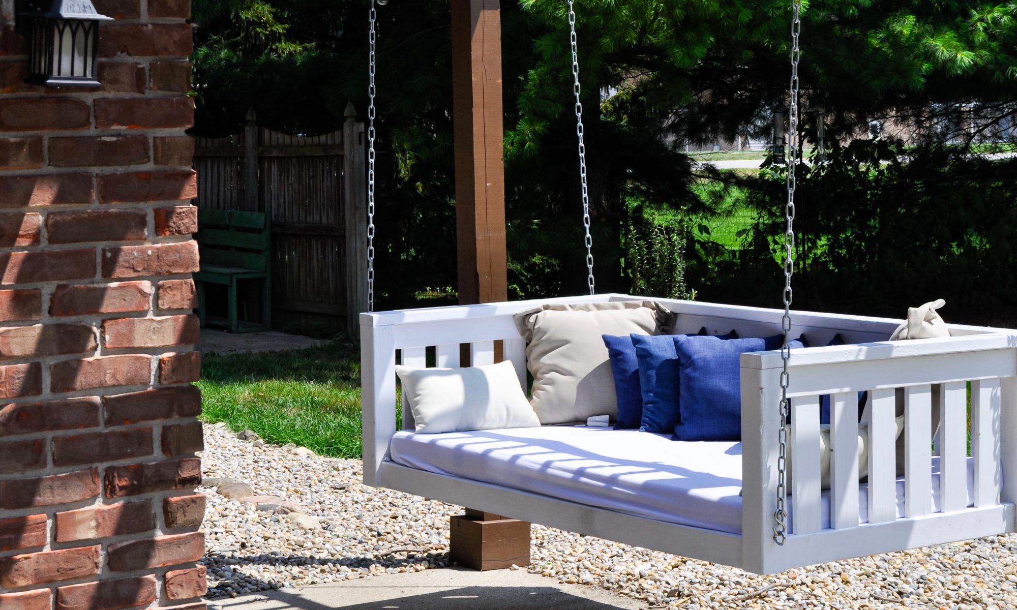Precision Outdoors Pergola & Patio Cedar Pergola wrap around gathering entertaining custom built furniture bench swing three piece deck chair set playground pad play space simple concrete patio installation custom daybed swing Greenwood indiana