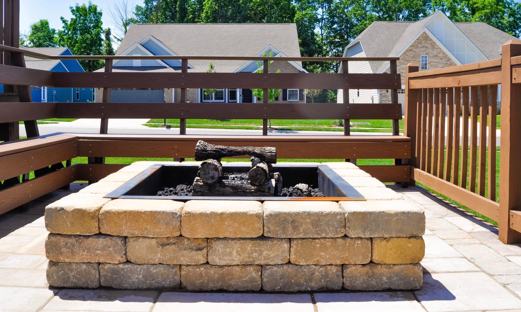 Precision Outdoors Fishers Pergola & Firepit cedar pergola structure firm paver patio beggar lafitt rustic slab Danville beige color accents wrap around firepit bench seating kids play area slide built in built-in deck sandbox play pad surrounding swing set area fishers indiana playground