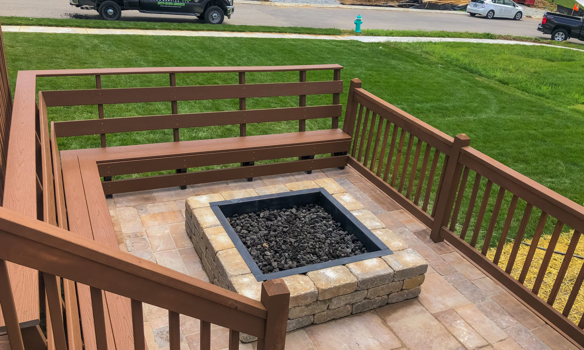 Precision Outdoors Fishers Pergola & Firepit cedar pergola structure firm paver patio beggar lafitt rustic slab Danville beige color accents wrap around firepit bench seating kids play area slide built in built-in deck sandbox play pad surrounding swing set area fishers indiana playground