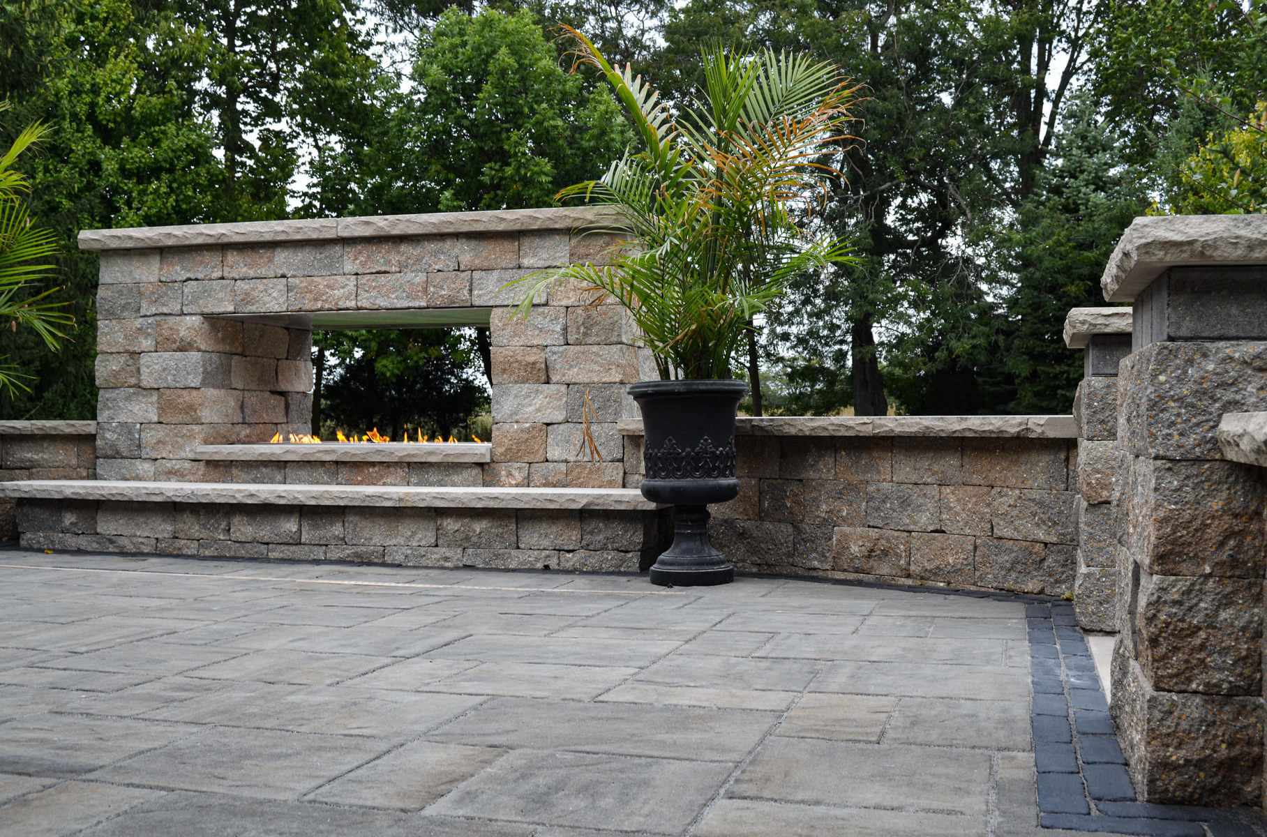 Precision Outdoors Greenwood Fireplace & patio custom paver patio secluded gathering space backyard dual fireplace gathering landscaping, mulching, straw and seed placement seeding unilock materials Greenwood indiana dream space