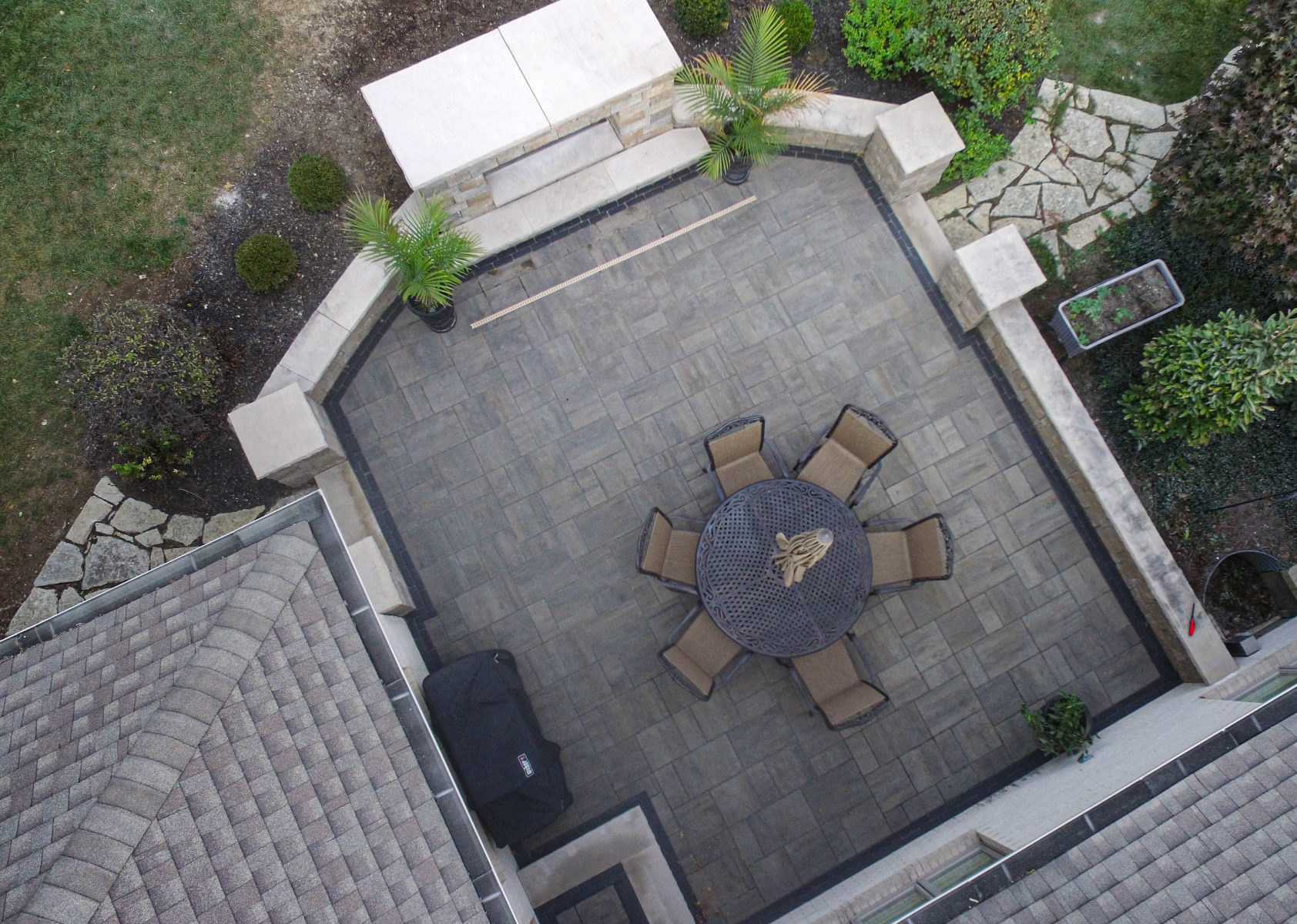 Precision Outdoors Greenwood Fireplace & patio custom paver patio secluded gathering space backyard dual fireplace gathering landscaping, mulching, straw and seed placement seeding unilock materials Greenwood indiana dream space