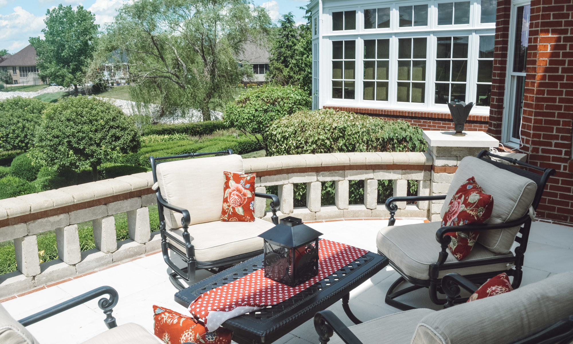 Precision Outdoors English Garden Overlook spiral stairs custom railing dining seating hosting custom patio brick retaining wall greenwood indiana patio