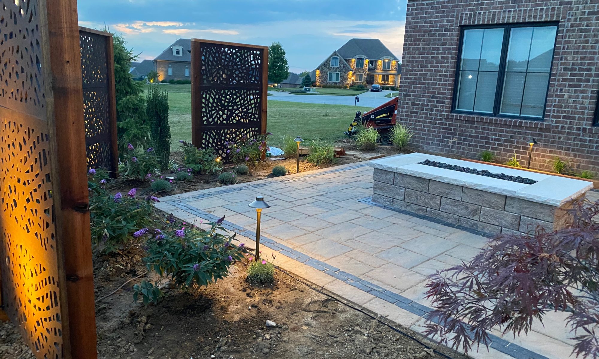 Precision Outdoors Kensington Oasis rough sawn cedar pergola black hardware decorative sunscreens outdoor gas firepit fire pit ample dining seating custom paver patio swinging daybed tech bloc semma wall sandlewood charcoal accent Carmel indiana backyard goals landscaping privacy