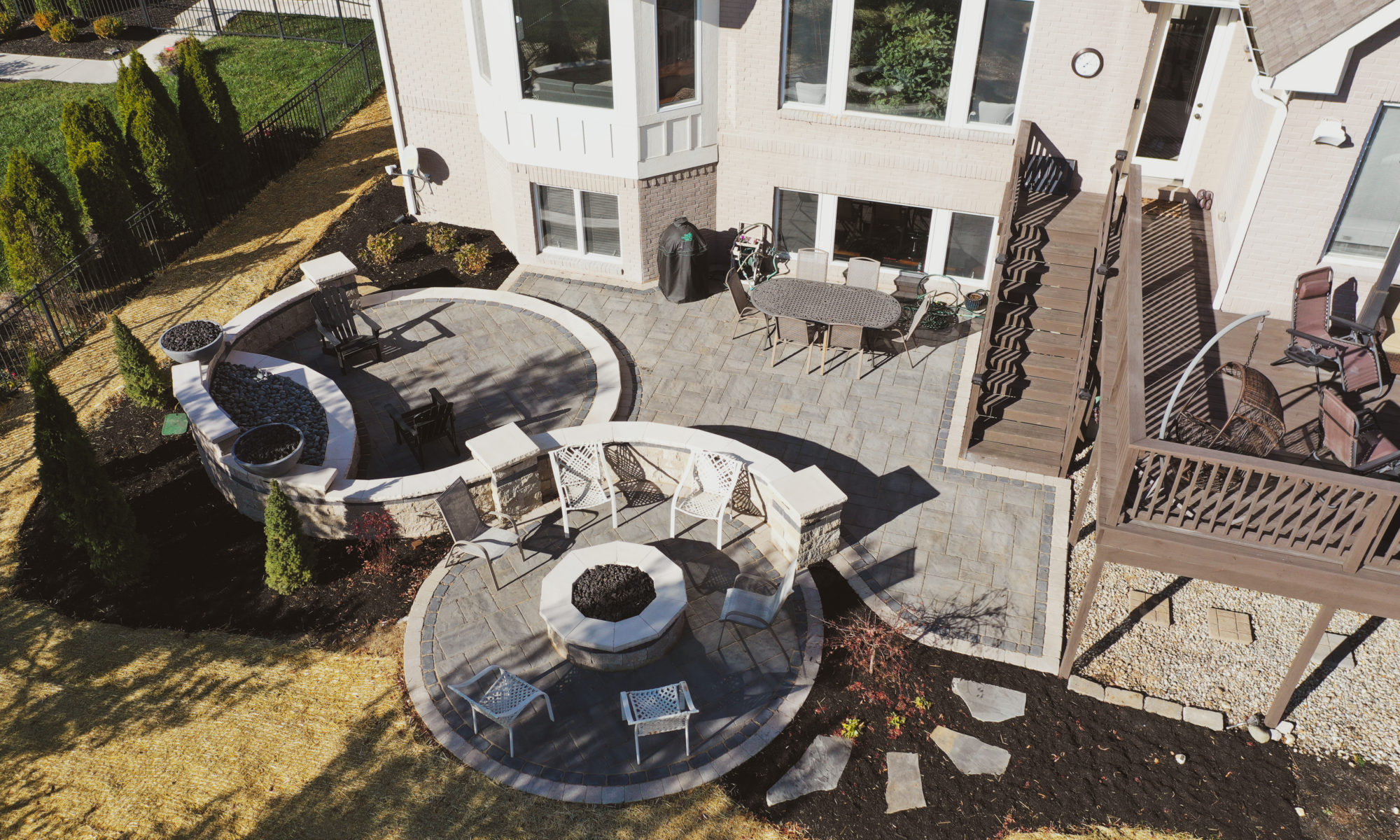 Precision Outdoor Curves of Fire gas firepit water feature two gas fire bowls unlock paver patio beacon hill flagstone alpine grey custom landscaping Noblesville indiana