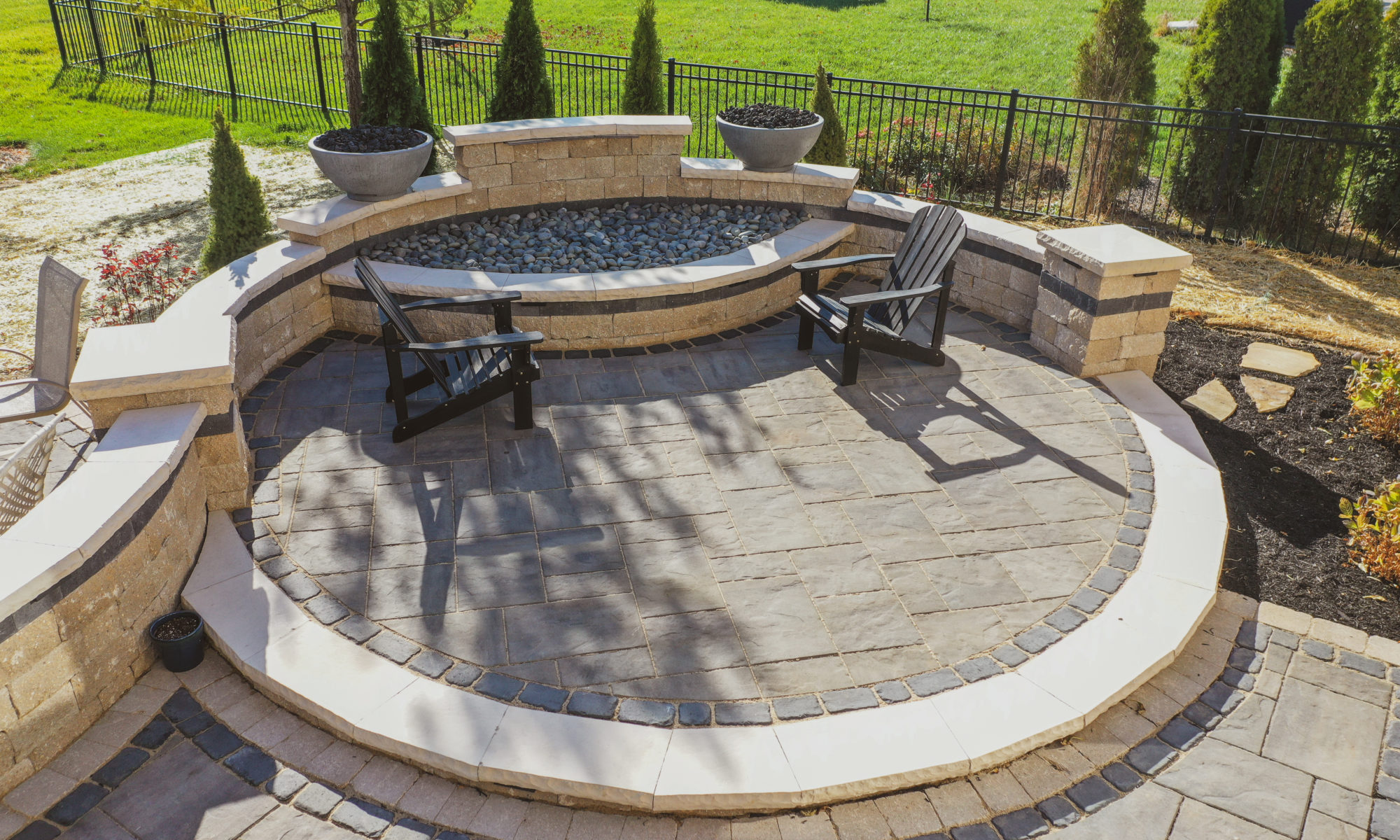 Precision Outdoor Curves of Fire gas firepit water feature two gas fire bowls unlock paver patio beacon hill flagstone alpine grey custom landscaping Noblesville indiana