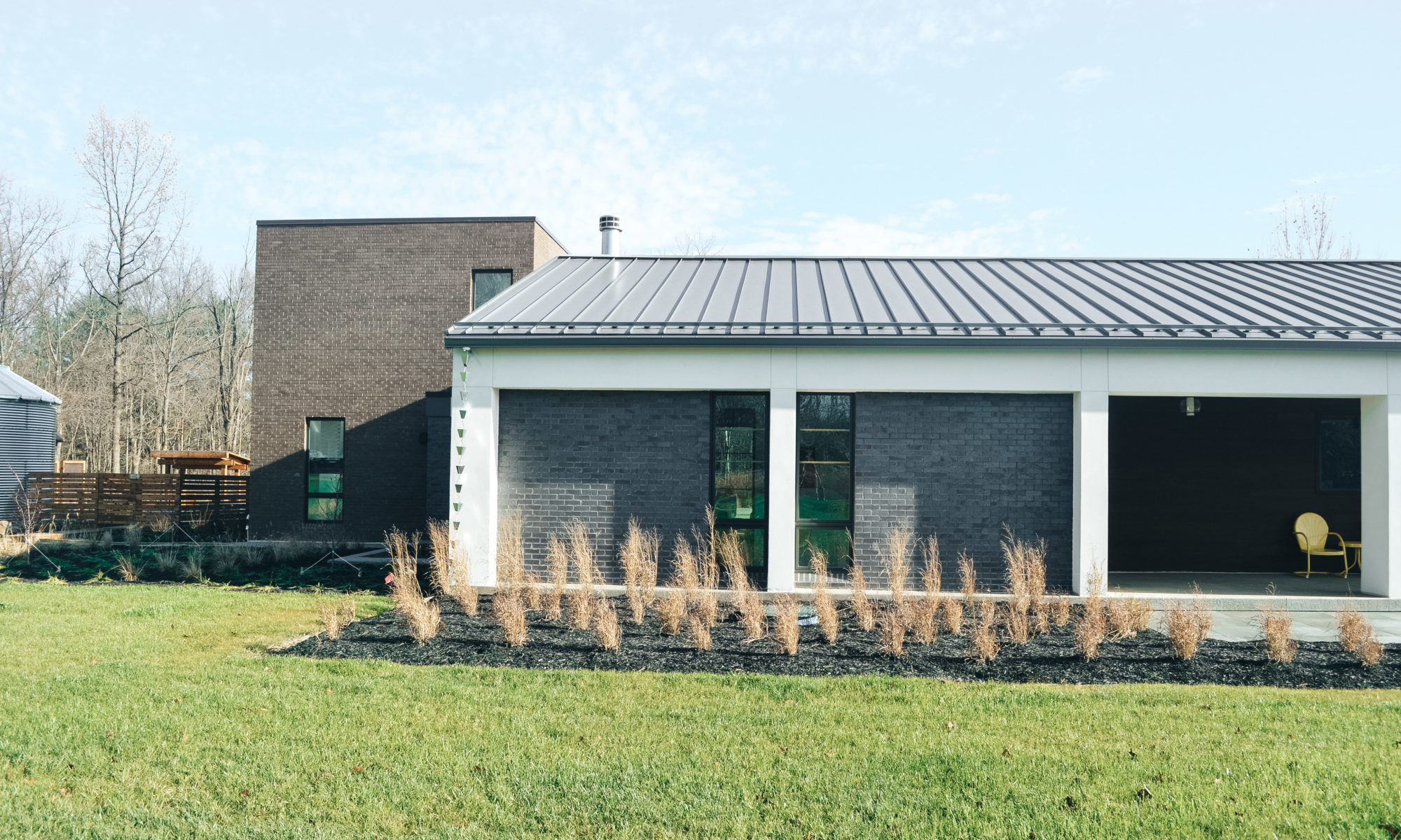 Precision Outdoors Carmel Art Silo custom landscaping swinging daybed walkways custom fencing Carmel indiana beautiful backyard