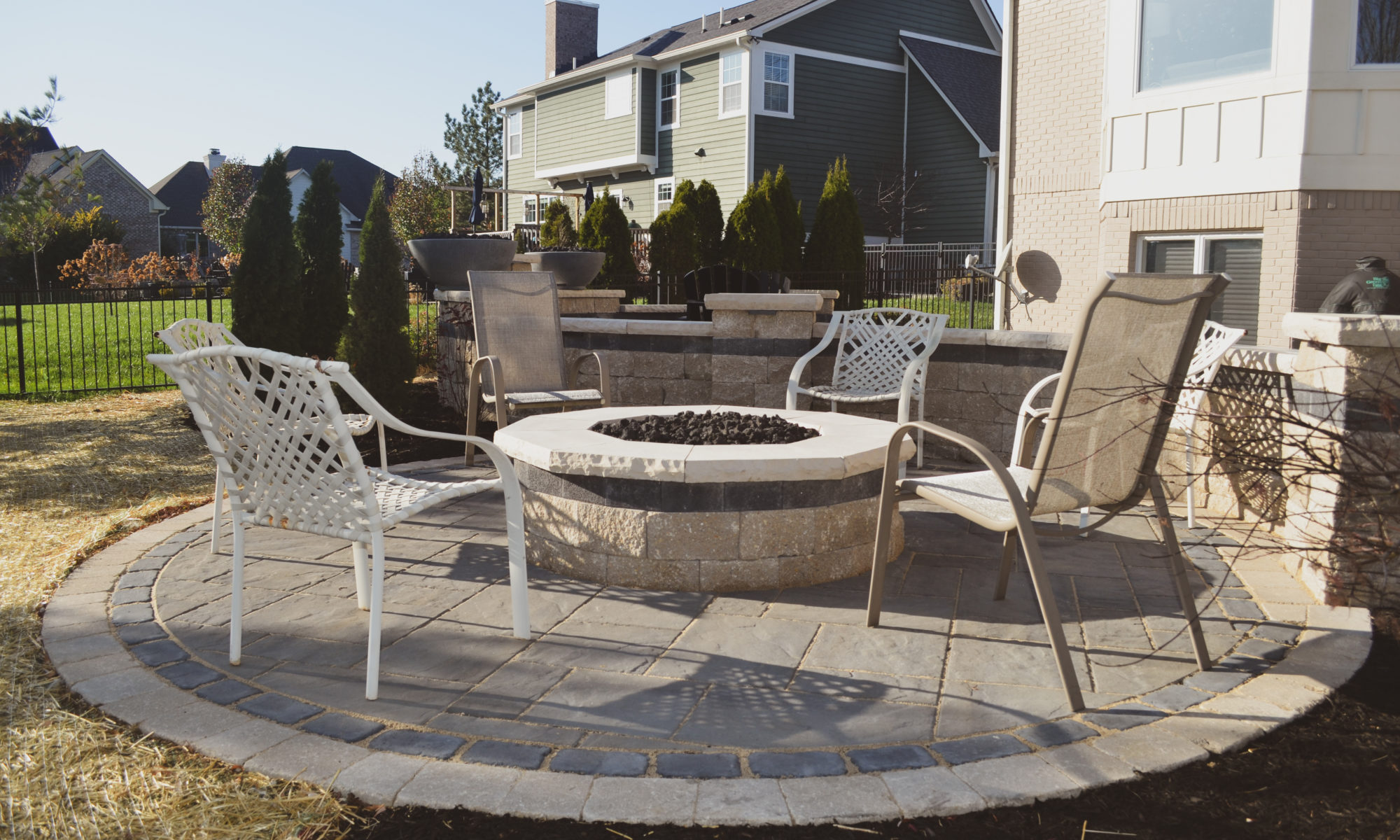 curves of fire firepit paver patio mulch water feature fireball bowl gas landscaping trees grass sod stone