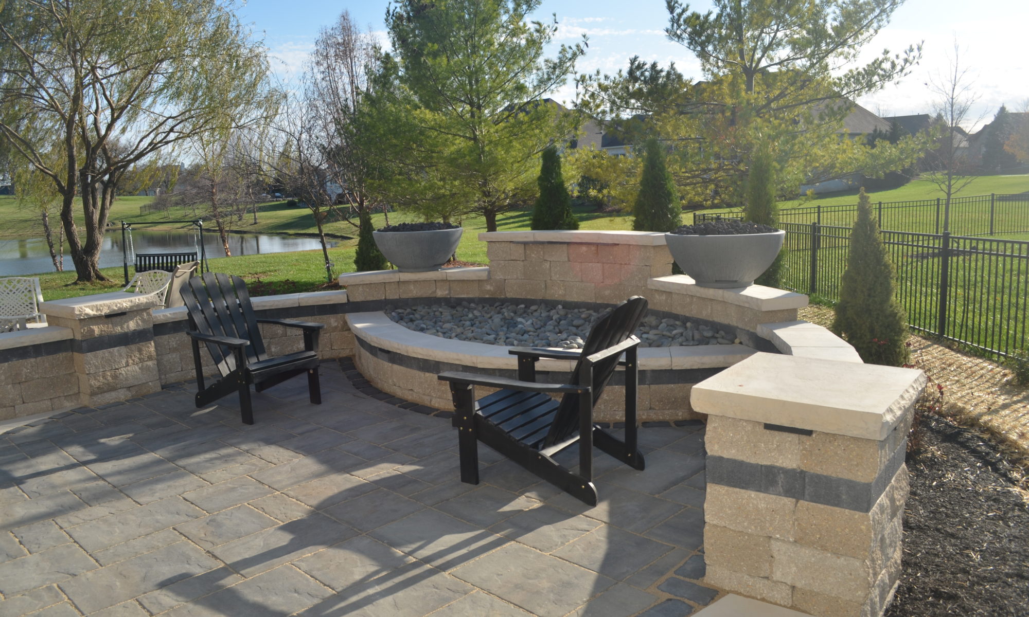 Precision Outdoor Curves of Fire gas firepit water feature two gas fire bowls unlock paver patio beacon hill flagstone alpine grey custom landscaping Noblesville indiana