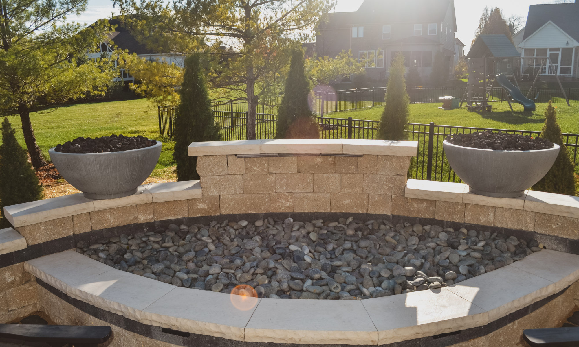 Precision Outdoor Curves of Fire gas firepit water feature two gas fire bowls unlock paver patio beacon hill flagstone alpine grey custom landscaping Noblesville indiana