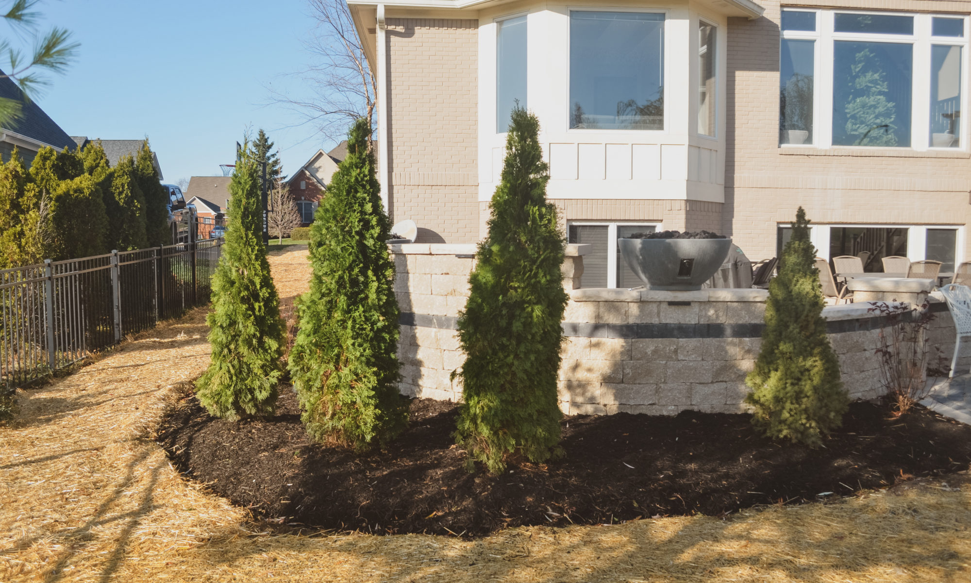 Precision Outdoor Curves of Fire gas firepit water feature two gas fire bowls unlock paver patio beacon hill flagstone alpine grey custom landscaping Noblesville indiana