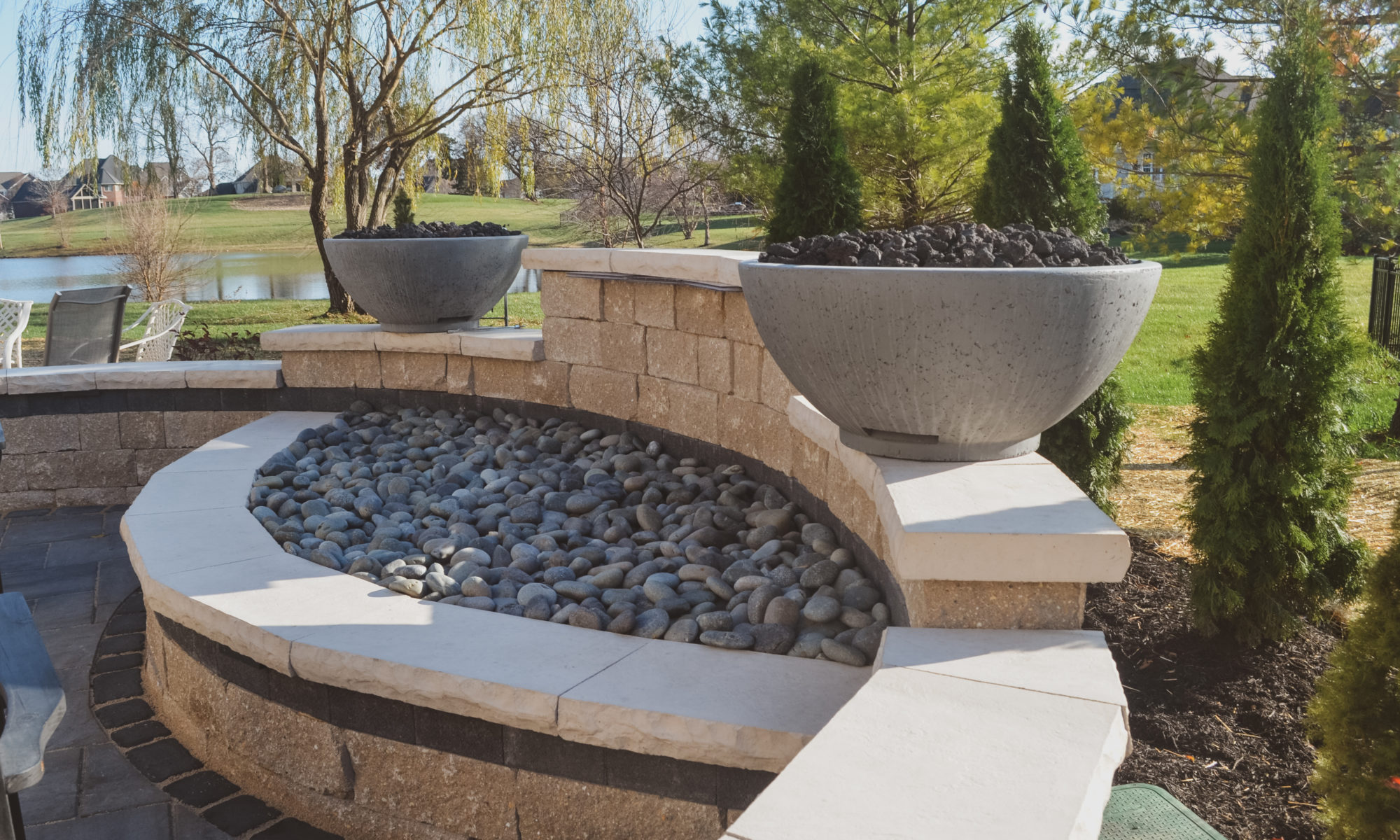 Precision Outdoor Curves of Fire gas firepit water feature two gas fire bowls unlock paver patio beacon hill flagstone alpine grey custom landscaping Noblesville indiana