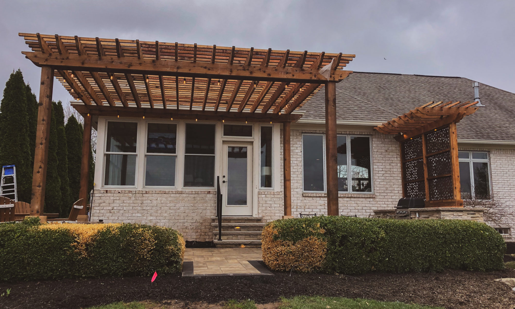 Precision Outdoors Hickory Stick Enclave cedar pergola built-in grill built in paver patio fence privacy screen screens flagstone walkway Bargersville Greenwood Indiana