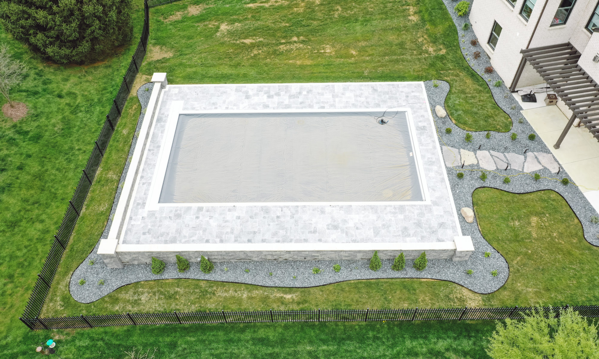 Precision Outdoors Travertine Pool Deck retaining wall limestone caps walkway path lights indianapolis indiana oberfield travertine ice marble accent strip