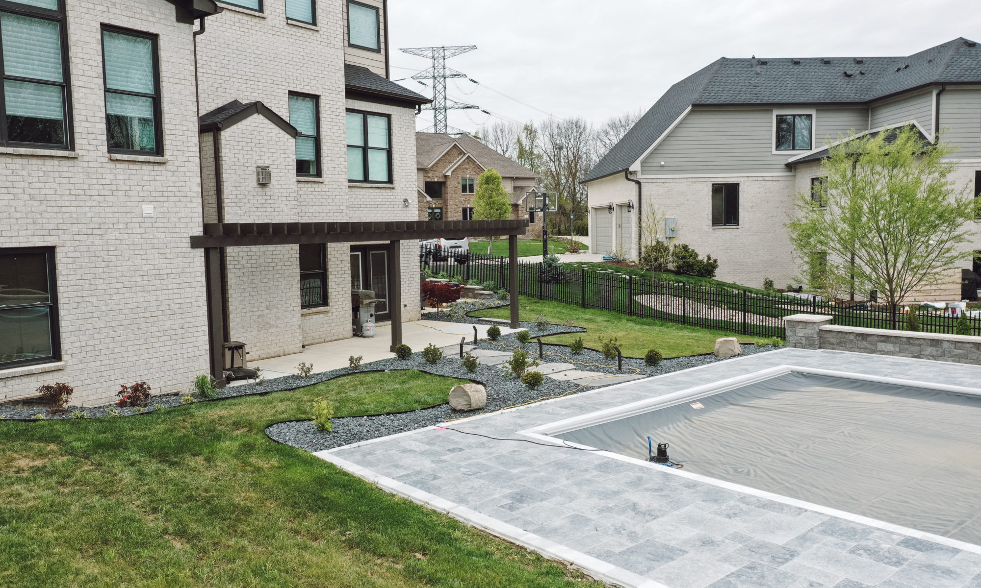 Precision Outdoors Travertine Pool Deck retaining wall limestone caps walkway path lights indianapolis indiana oberfield travertine ice marble accent strip overfilled versalok versa-lok granite blend taho marble