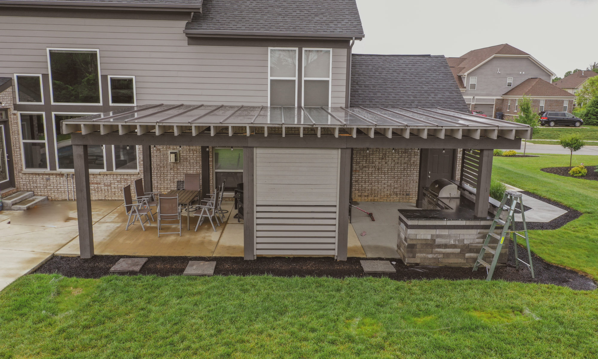 Precision Outdoors Modern Covered Pergola plexiglass covering grill island decorative privacy screens concrete patio Bargersville indiana