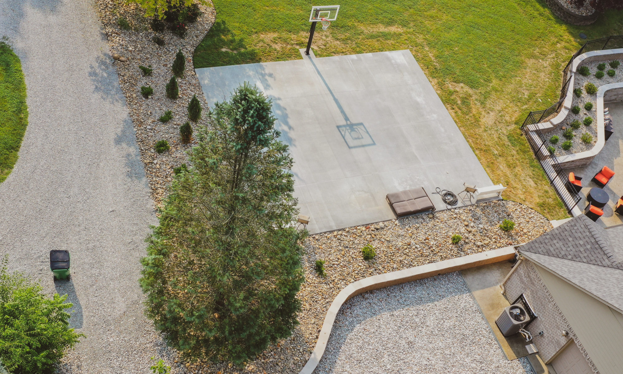 precision outdoors design build construction landscaping waterfall patio paver firepit seating wall seating wall pool deck basketball court ball hoops rocks boulders