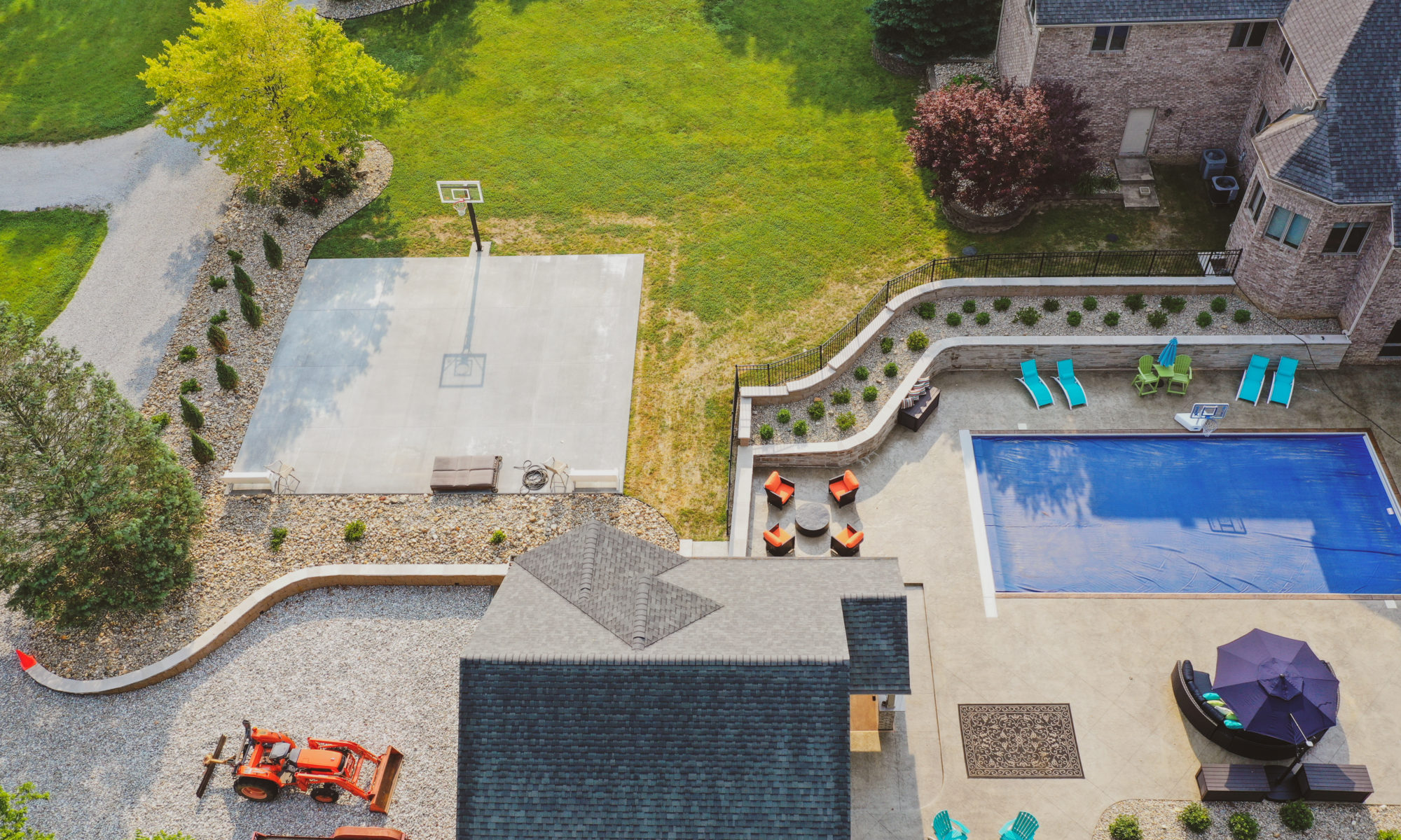 Precision Outdoors the epic waterfall rocks boulders stairs outdoor dream backyard fire pit pool waterfall indianapolis indiana seating wall amazing basketball court landscaping