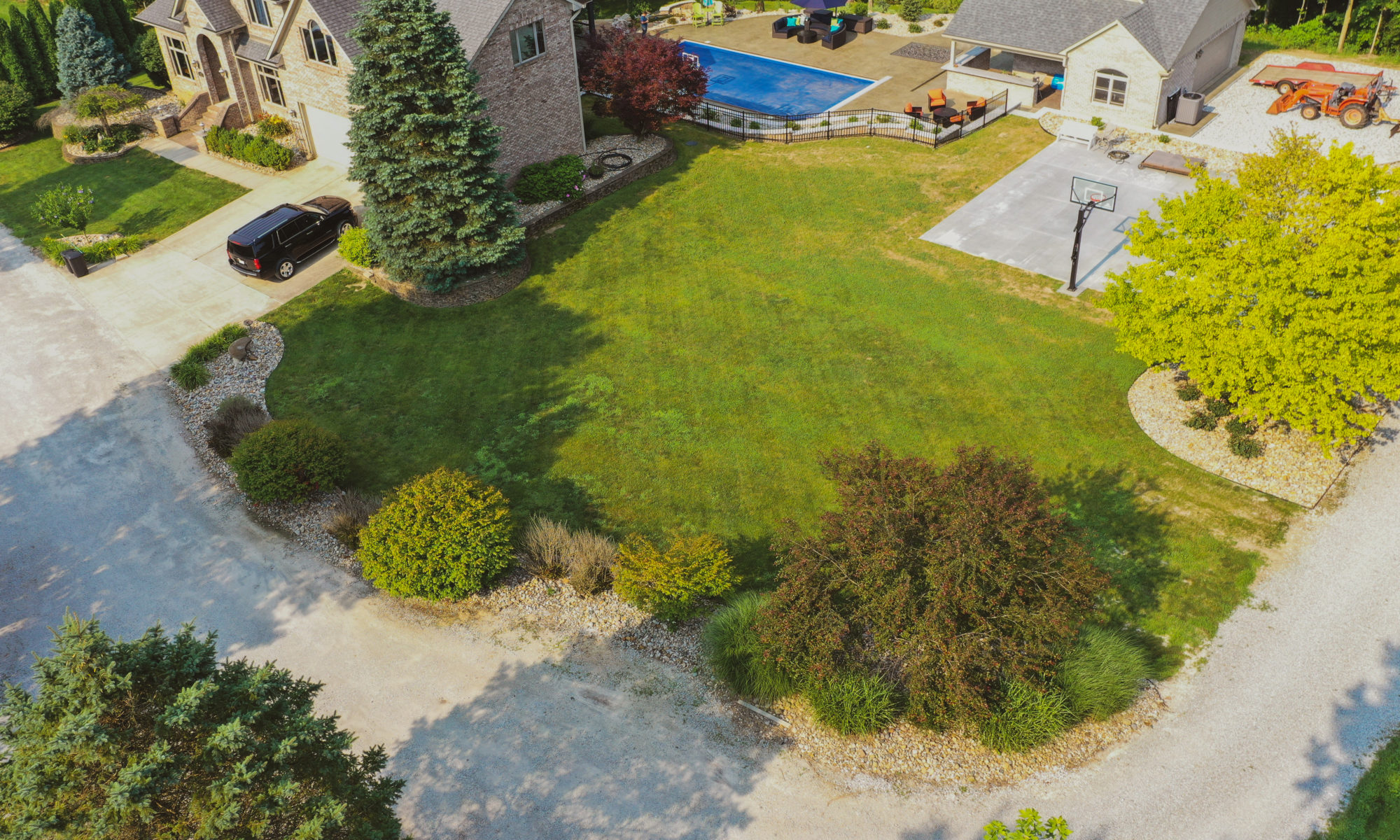 Precision Outdoors the epic waterfall rocks boulders stairs outdoor dream backyard fire pit pool waterfall indianapolis indiana seating wall amazing basketball court landscaping