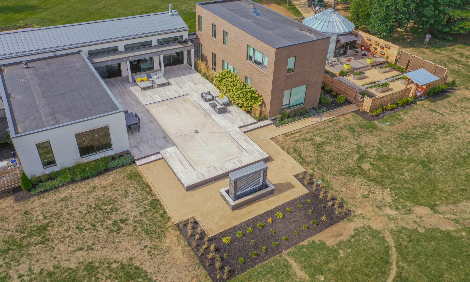 Precision Outdoors Carmel Art Silo Deck custom water feature outdoor living by Belgard noon tile pool deck custom landscaping Carmel indiana dream backyard goals