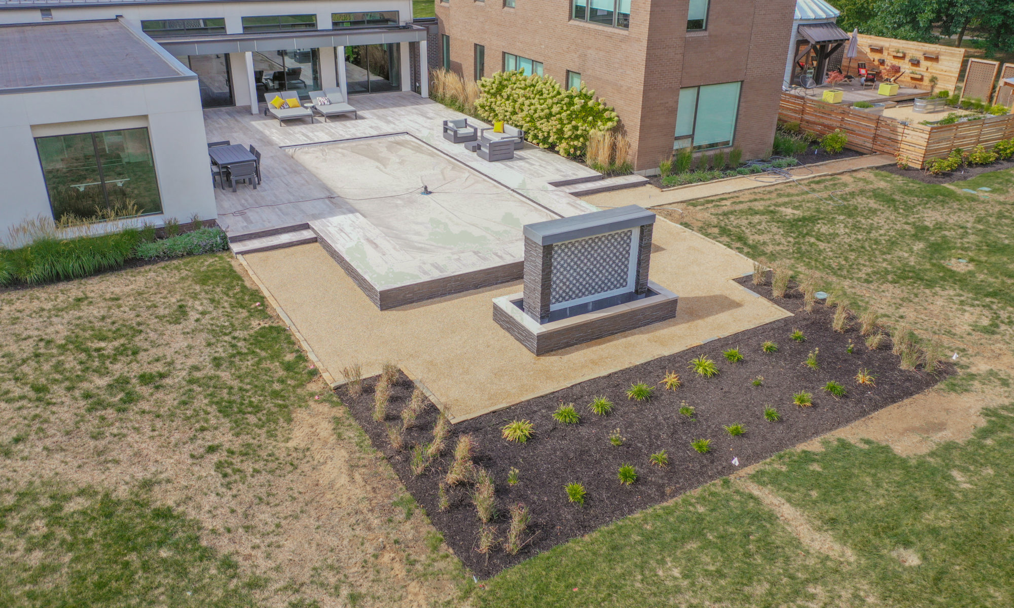 Precision Outdoors Carmel Art Silo Deck custom water feature outdoor living by Belgard noon tile pool deck custom landscaping Carmel indiana dream backyard goals