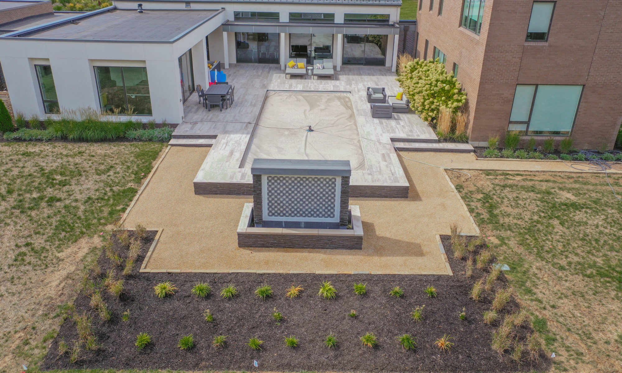 Precision Outdoors Carmel Art Silo Deck custom water feature outdoor living by Belgard noon tile pool deck custom landscaping Carmel indiana dream backyard goals