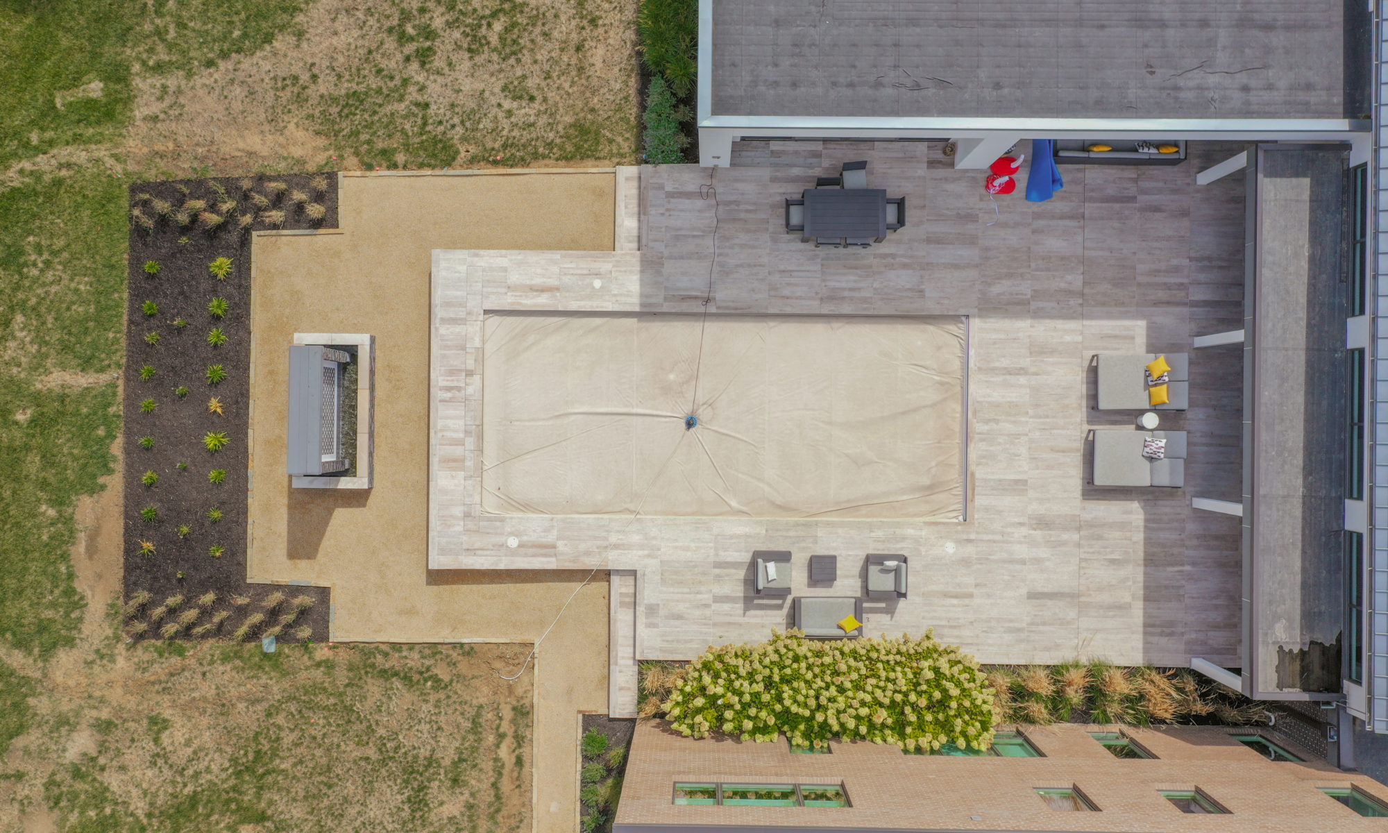 Precision Outdoors Carmel Art Silo Deck custom water feature outdoor living by Belgard noon tile pool deck custom landscaping Carmel indiana dream backyard goals