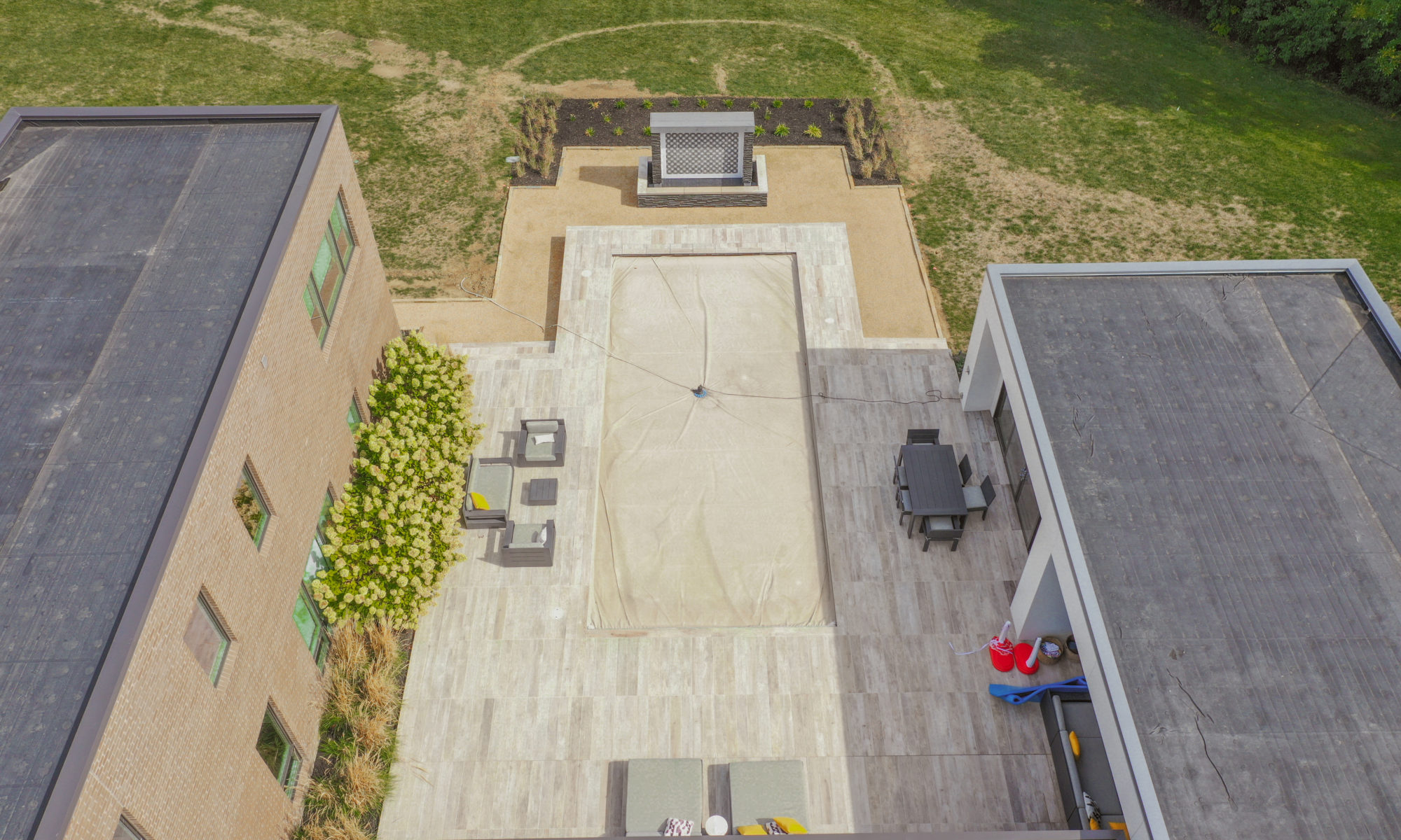 Precision Outdoors Carmel Art Silo Deck custom water feature outdoor living by Belgard noon tile pool deck custom landscaping Carmel indiana dream backyard goals