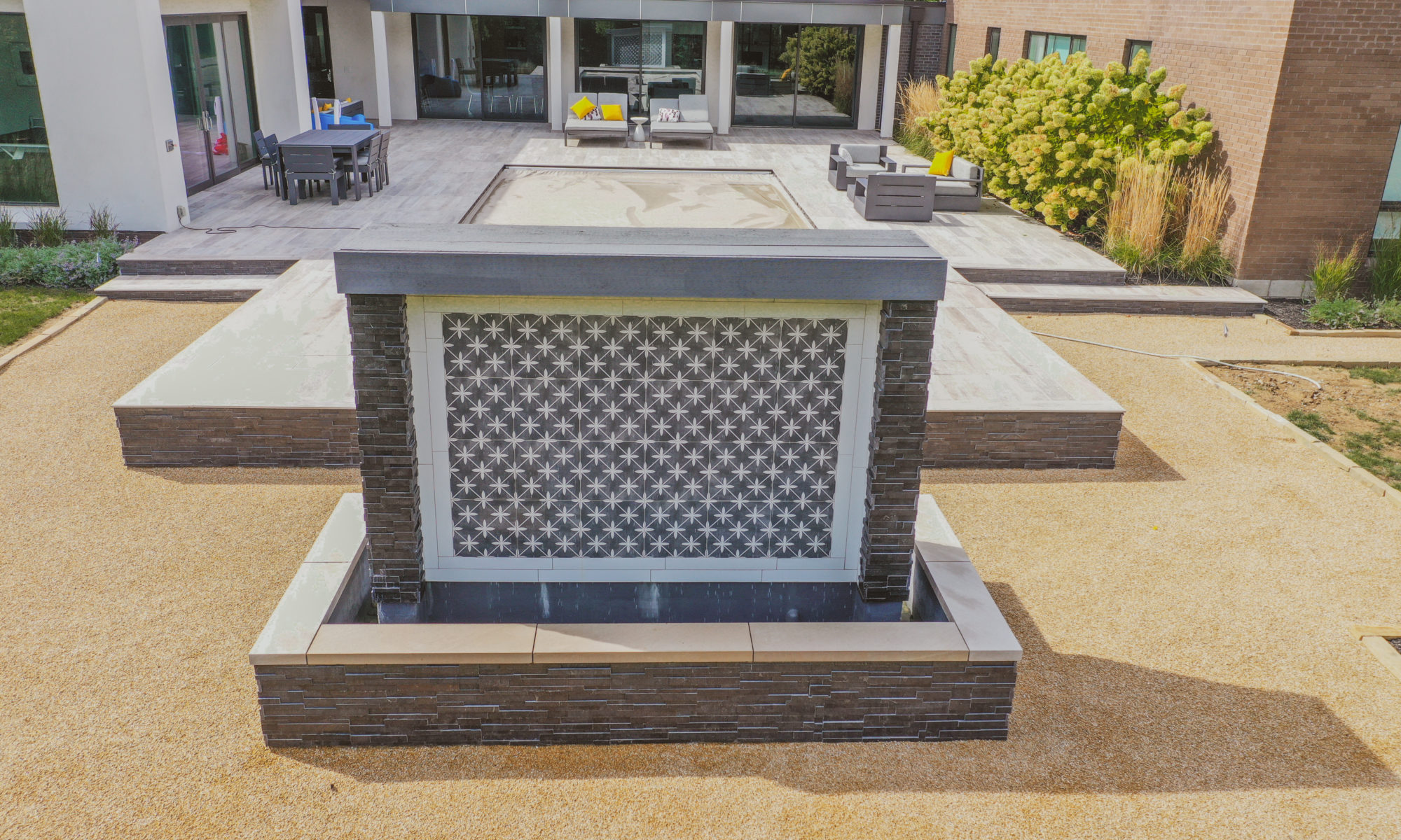 Precision Outdoors Carmel Art Silo Deck custom water feature outdoor living by Belgard noon tile pool deck custom landscaping Carmel indiana dream backyard goals