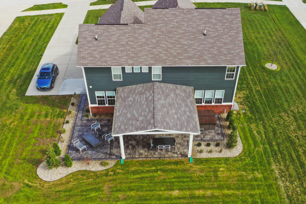 Precision Outdoors Classic Paver and firepit gable roof structure linear gas firepit paver patio custom landscaping Greenwood Indiana