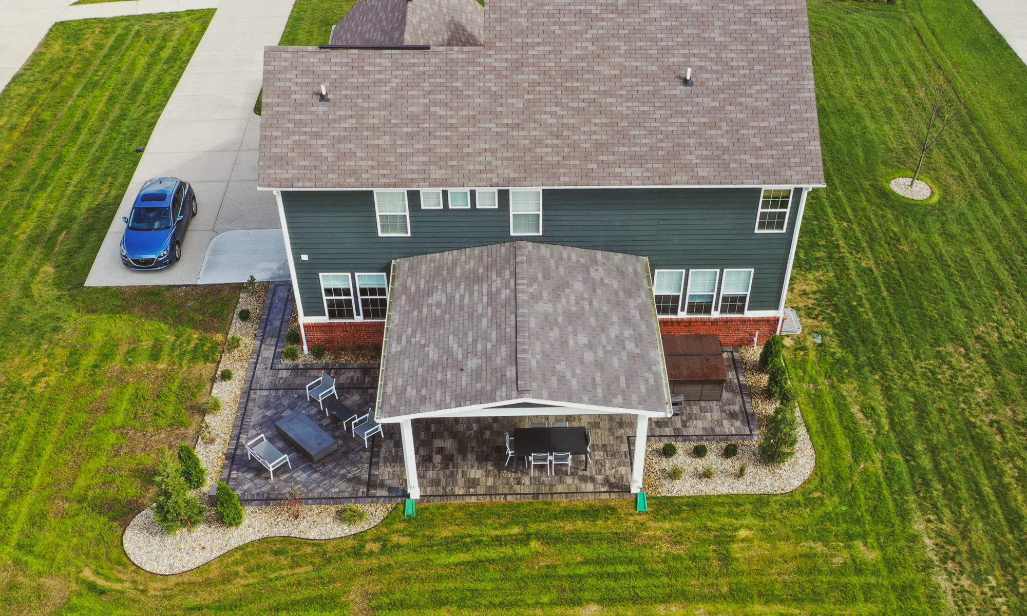 Precision Outdoors Classic Paver and firepit gable roof structure linear gas firepit paver patio custom landscaping Greenwood Indiana