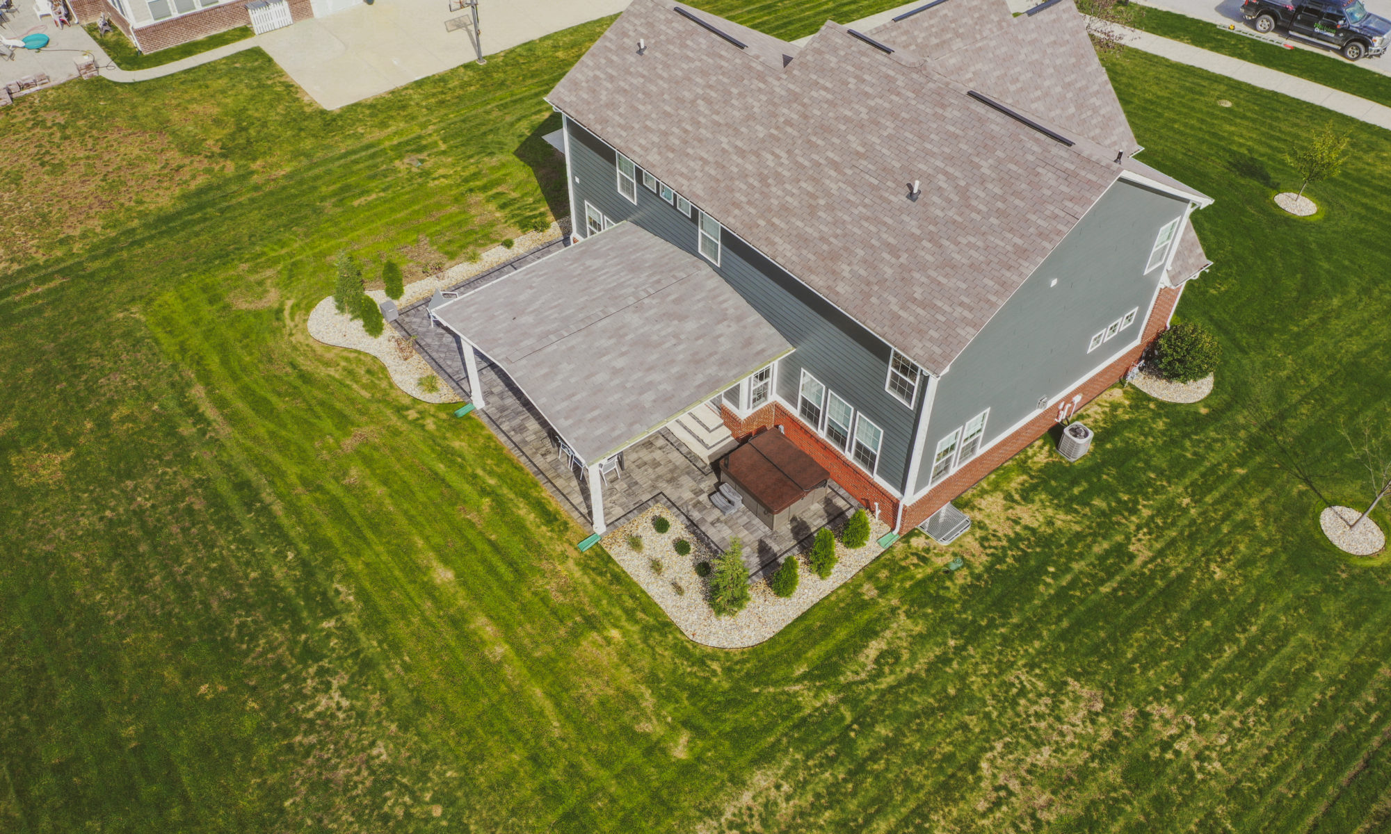 Precision Outdoors Classic Paver and firepit gable roof structure linear gas firepit paver patio custom landscaping Greenwood Indiana