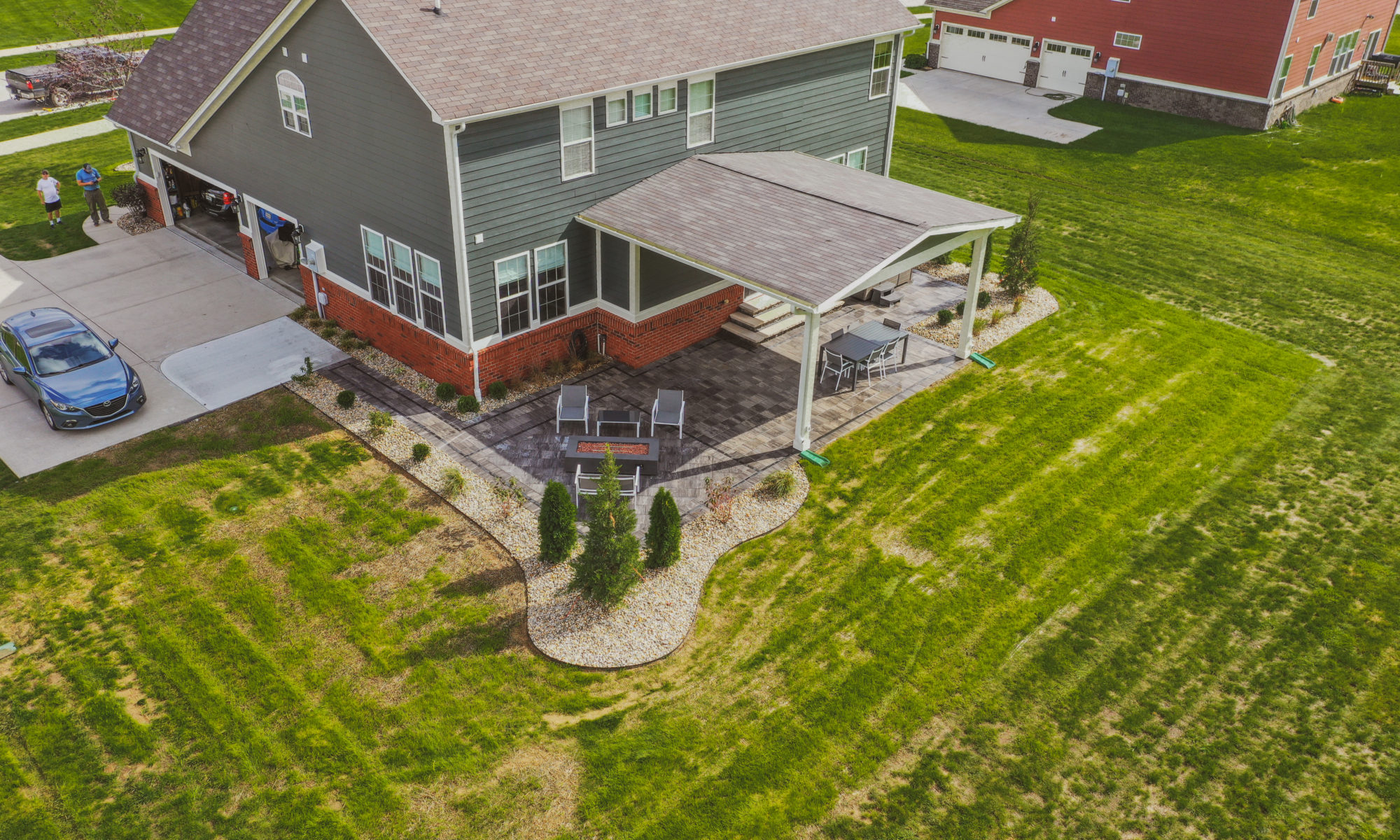 Precision Outdoors Classic Paver and firepit gable roof structure linear gas firepit paver patio custom landscaping Greenwood Indiana