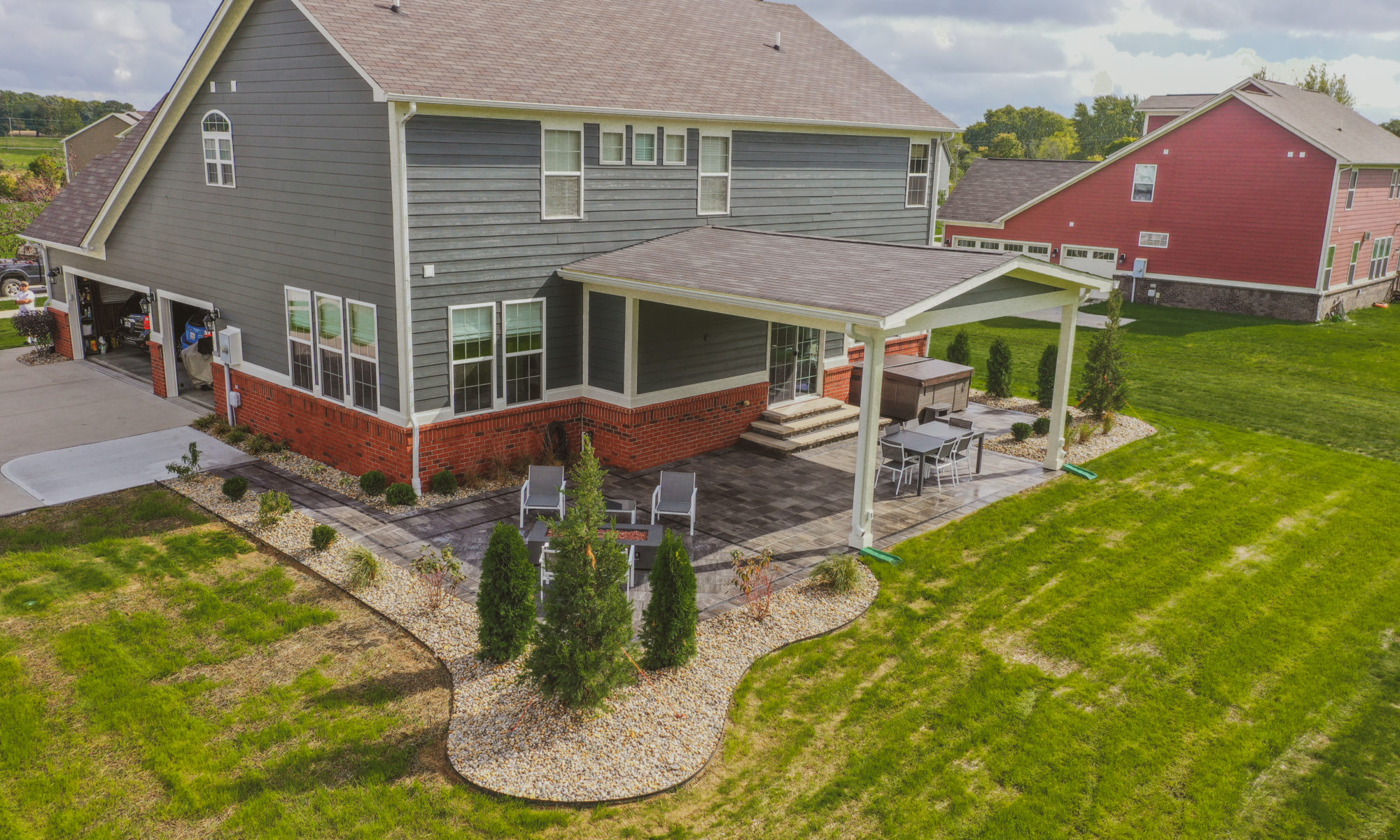 Precision Outdoors Classic Paver and firepit gable roof structure linear gas firepit paver patio custom landscaping Greenwood Indiana