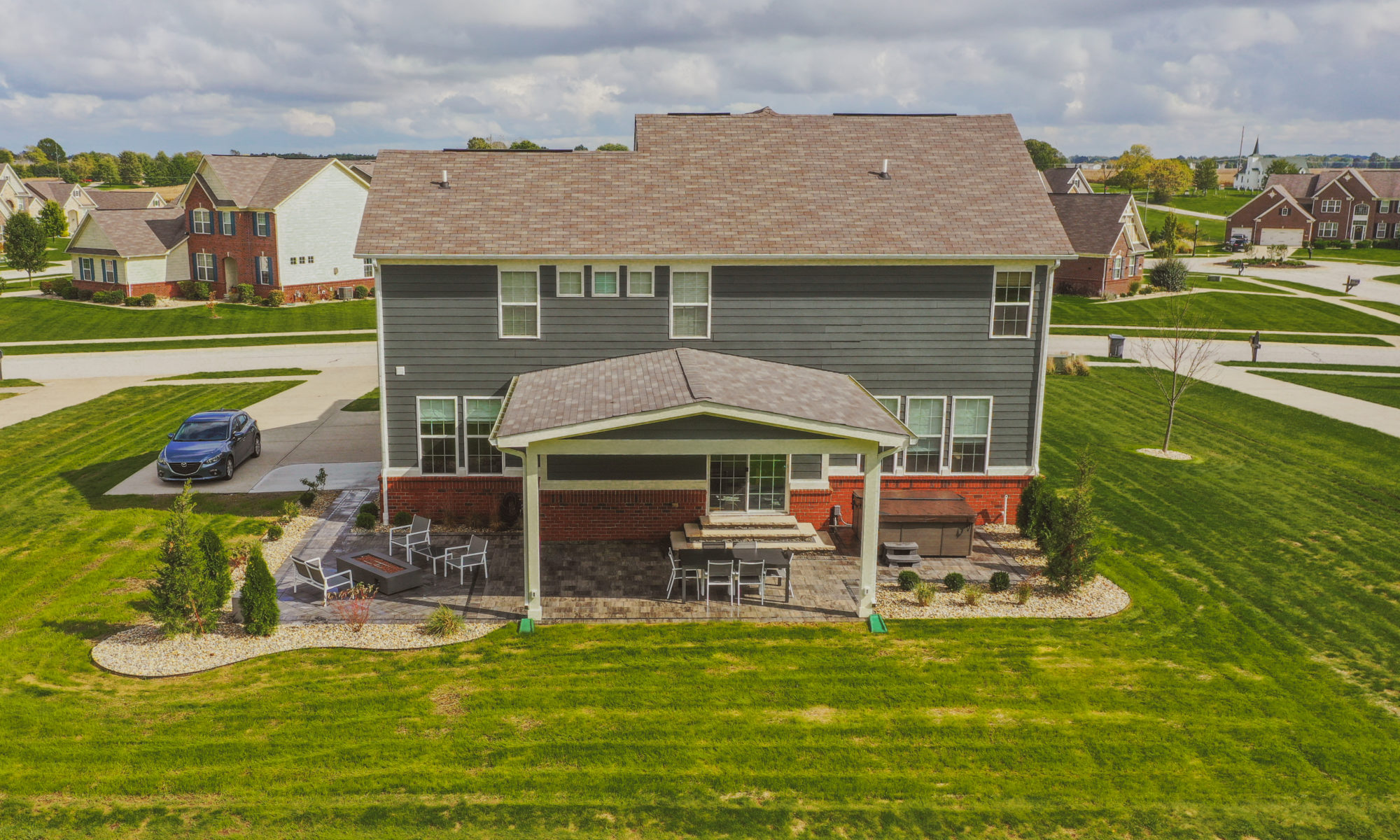 Precision Outdoors Classic Paver and firepit gable roof structure linear gas firepit paver patio custom landscaping Greenwood Indiana