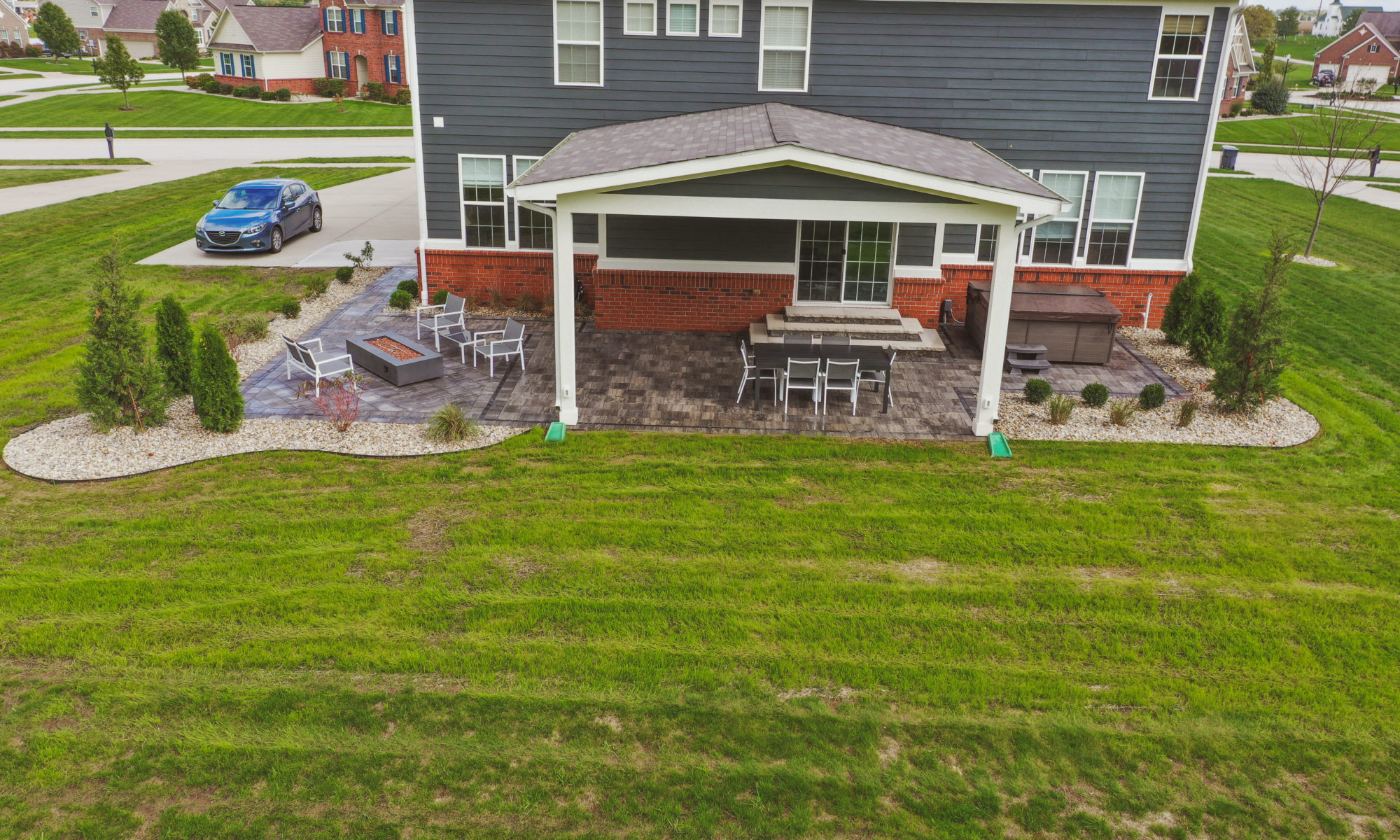 Precision Outdoors Classic Paver and firepit gable roof structure linear gas firepit paver patio custom landscaping Greenwood Indiana