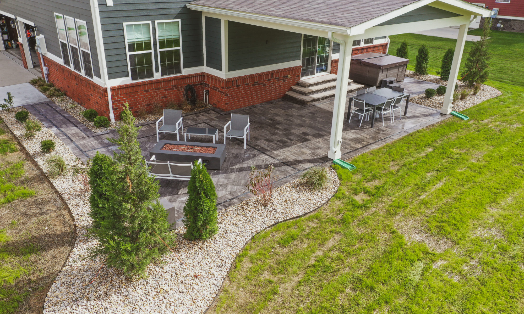 Precision Outdoors Classic Paver and firepit gable roof structure linear gas firepit paver patio custom landscaping Greenwood Indiana