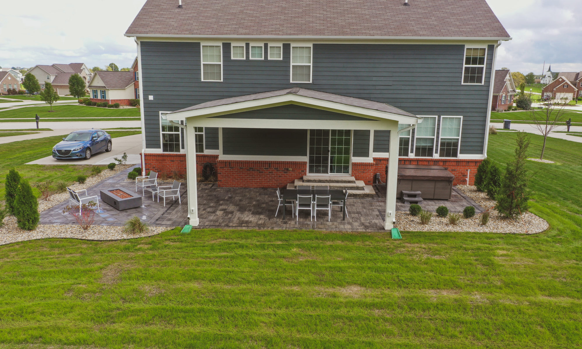 Precision Outdoors Classic Paver and firepit gable roof structure linear gas firepit paver patio custom landscaping Greenwood Indiana