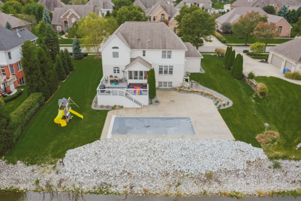 Precision Outdoors Poolside Landscaping Project Custom landscaping plants shrubs small boulders indianapolis Indiana dream backyard