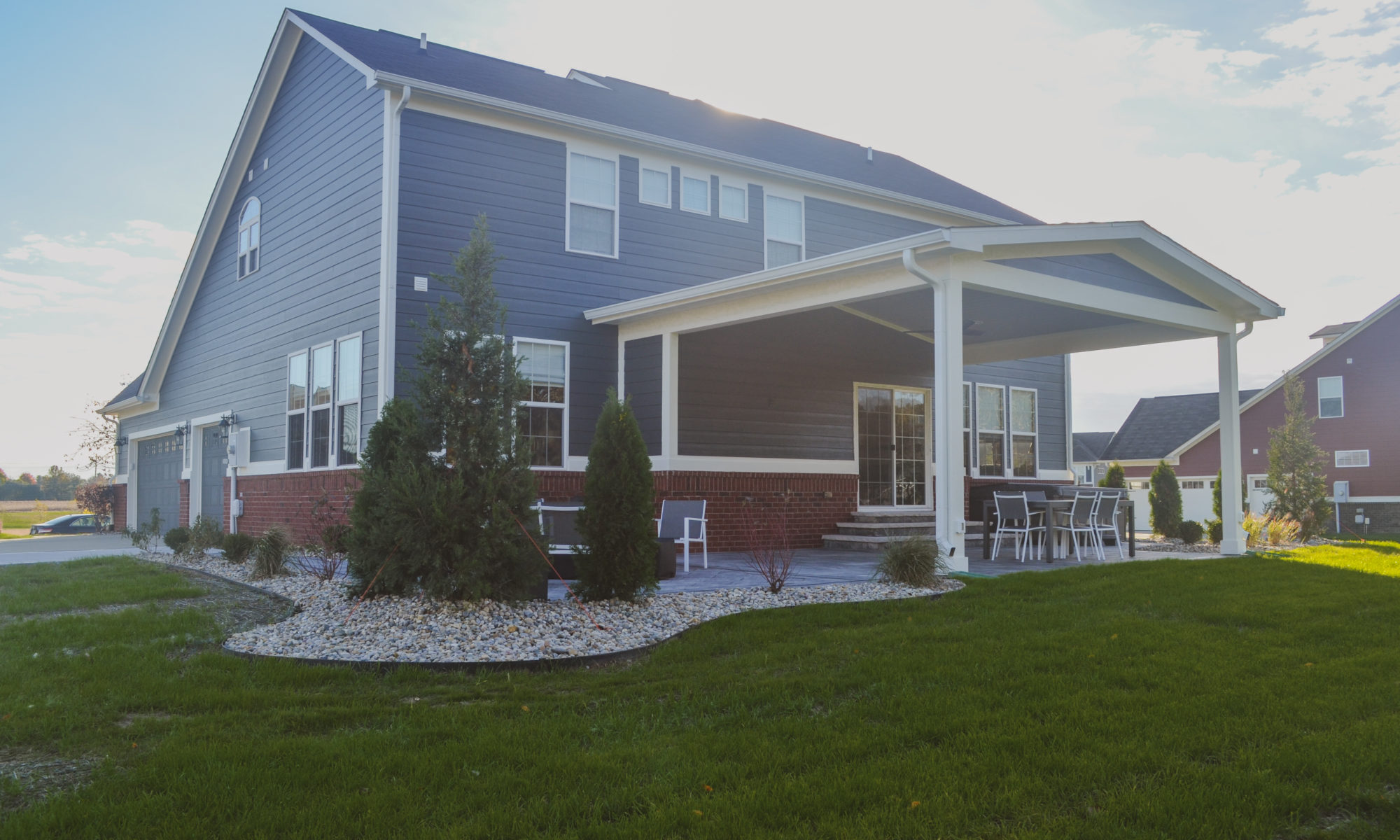 Precision Outdoors Classic Paver and firepit gable roof structure linear gas firepit paver patio custom landscaping Greenwood Indiana