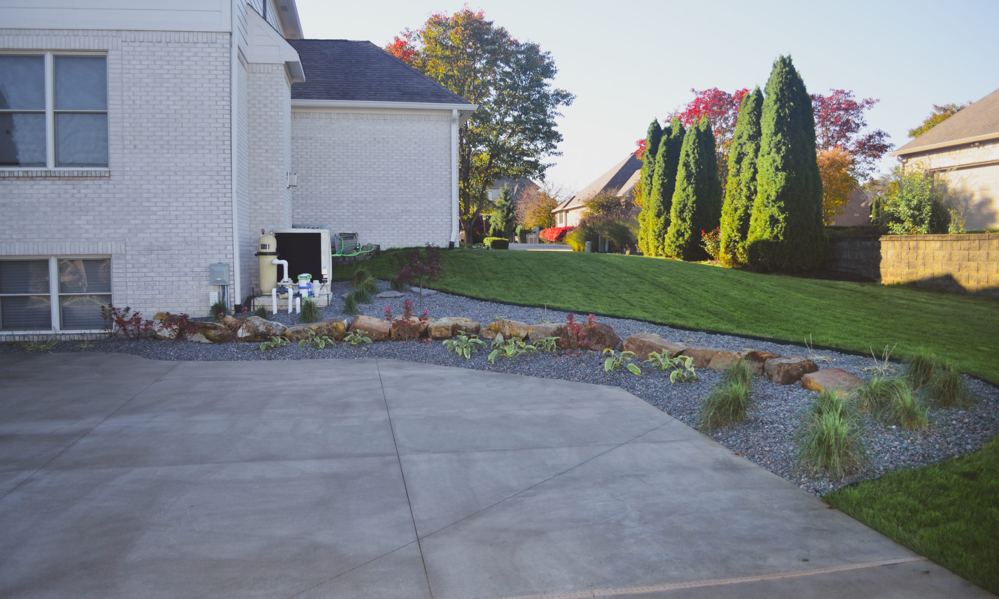 Precision Outdoors Poolside Landscaping Project Custom landscaping plants shrubs small boulders indianapolis Indiana dream backyard