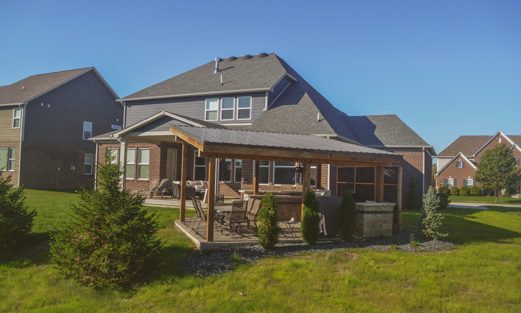 Precision Outdoors Emerald Ridge Hideaway shed roof structure paver patio outdoor kitchen barter seating privacy screens walking stone indianapolis indiana privacy screens
