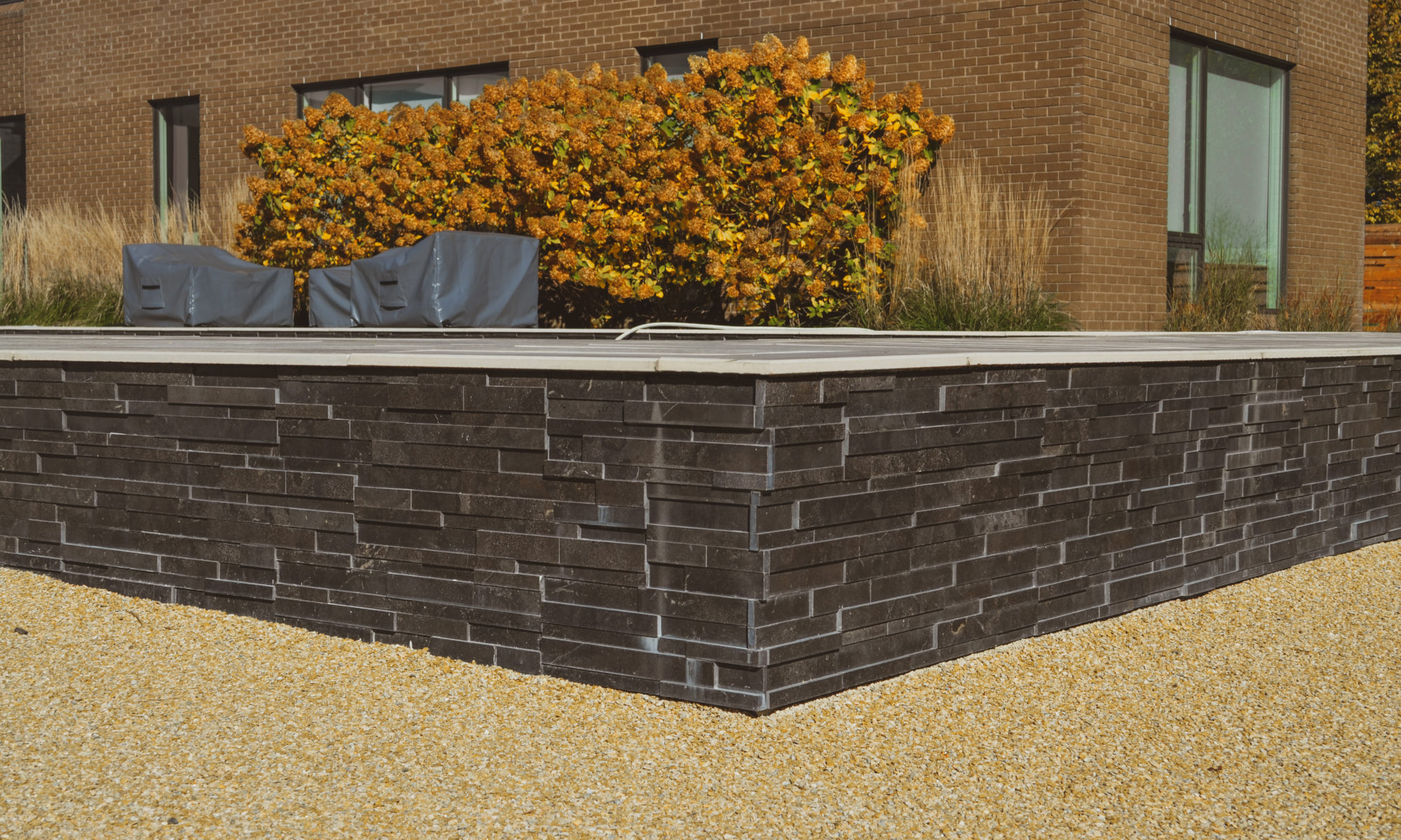 Precision Outdoors Carmel Art Silo Deck custom water feature outdoor living by Belgard noon tile pool deck custom landscaping Carmel indiana dream backyard goals